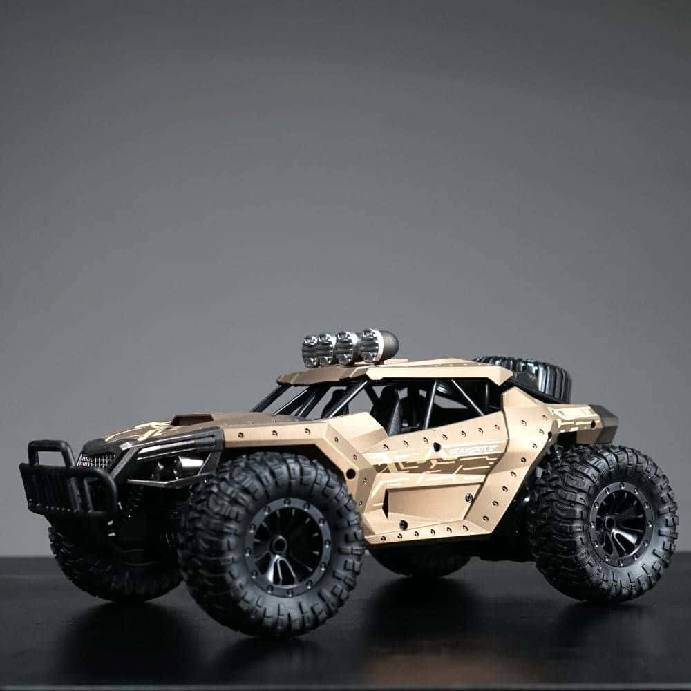 tan and black remote-controlled off-road vehicle, large knobby tires, roof-mounted lights, SD Desktop Wallpaper
