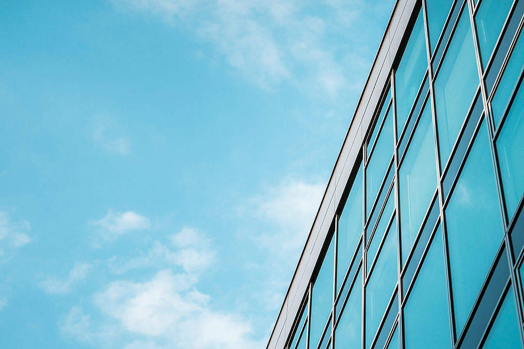 modern glass skyscraper, bright blue sky, wispy white clouds, SD Desktop Wallpaper