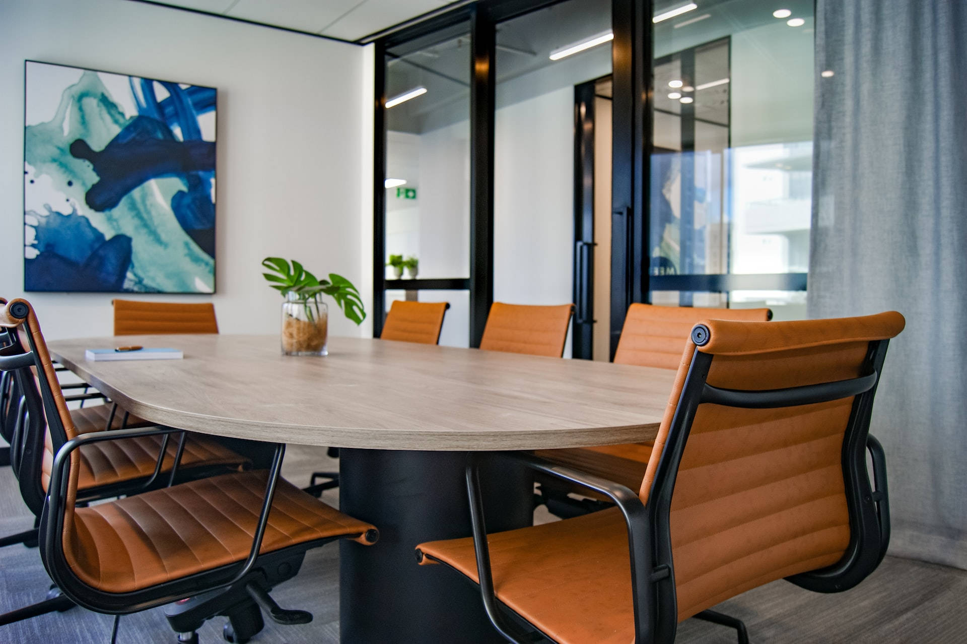 Modern conference room, wooden table, orange chairs, Full HD Desktop Wallpaper