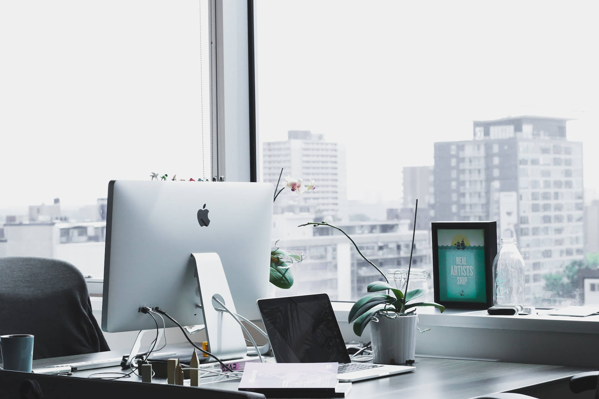 iMac laptop, orchid plant, city skyline, Full HD Desktop Wallpaper