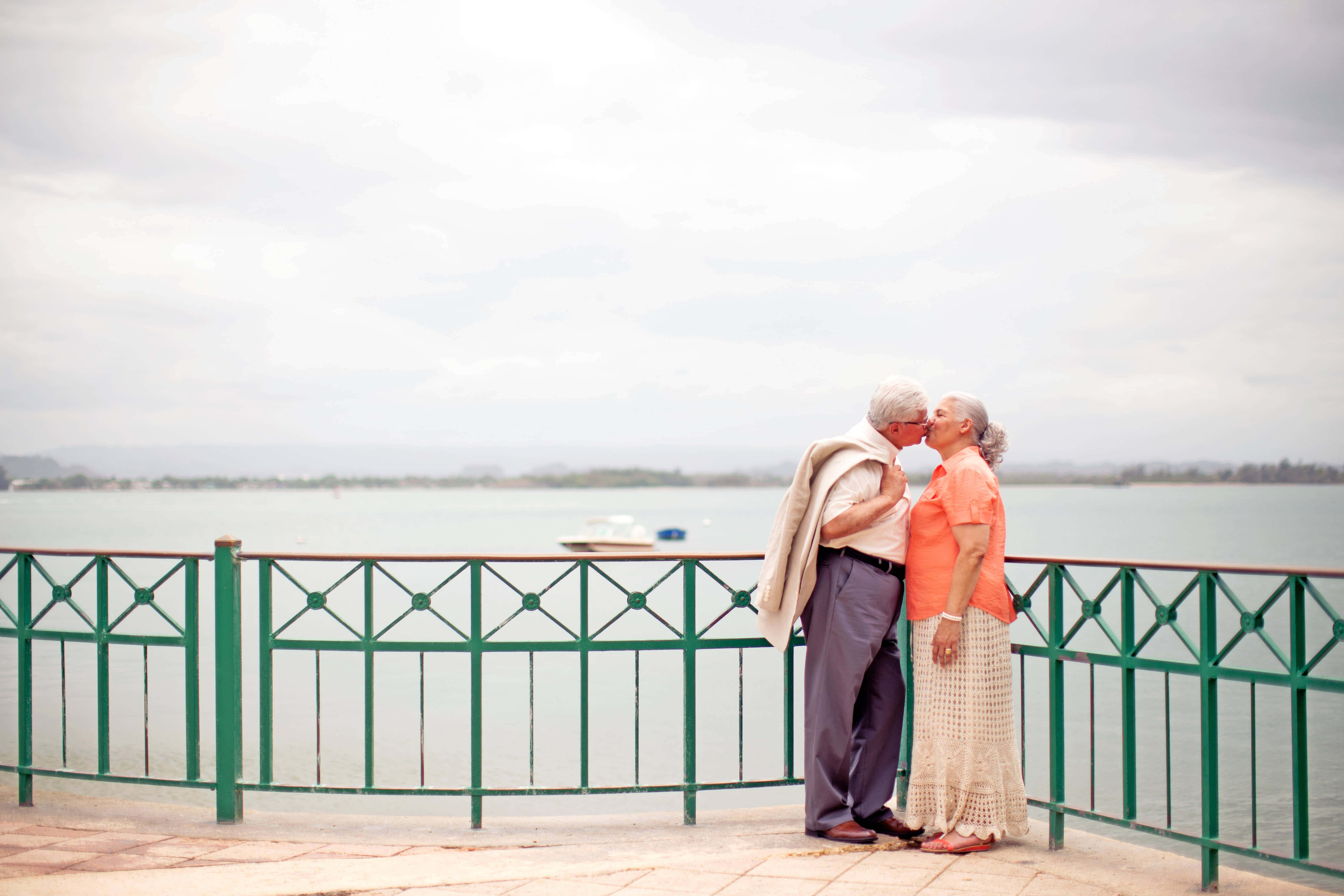 Old Couple, waterfront promenade, overcast sky, 5K Desktop Wallpaper