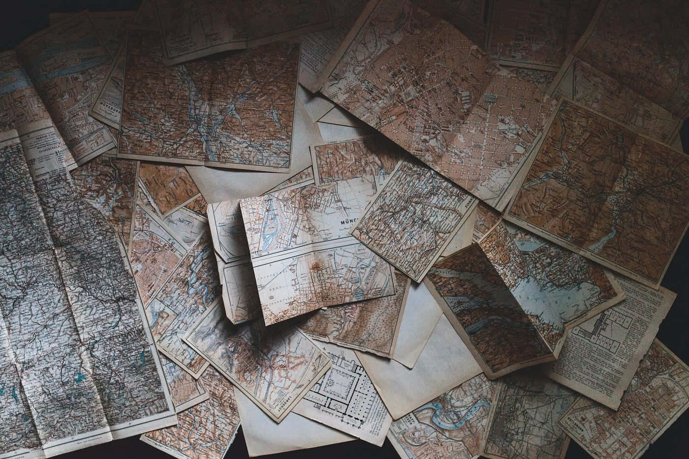 vintage paper maps, earthy tones, dark surface, HD Desktop Wallpaper