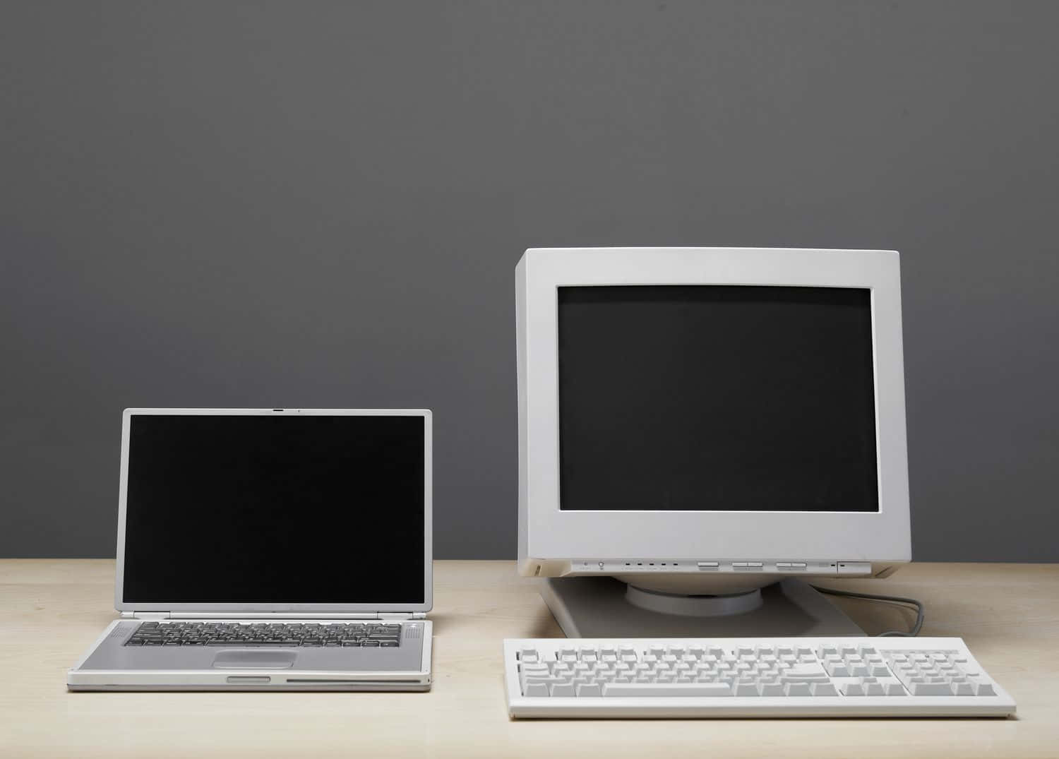 silver laptop, white CRT monitor, wooden desk, HD Desktop Wallpaper