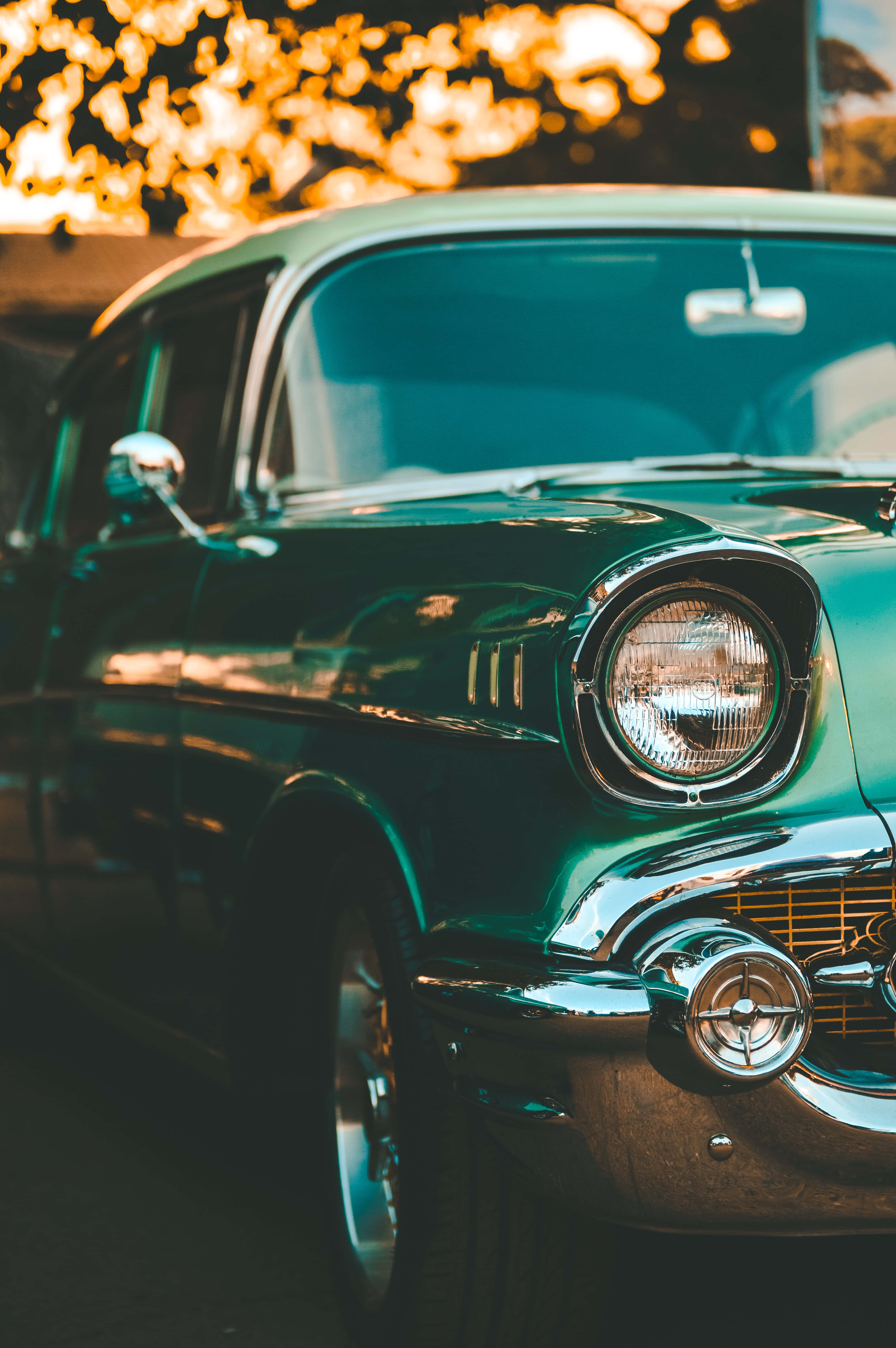 Old School Mobile, vintage teal car, golden sunset light, 5K Phone Wallpaper