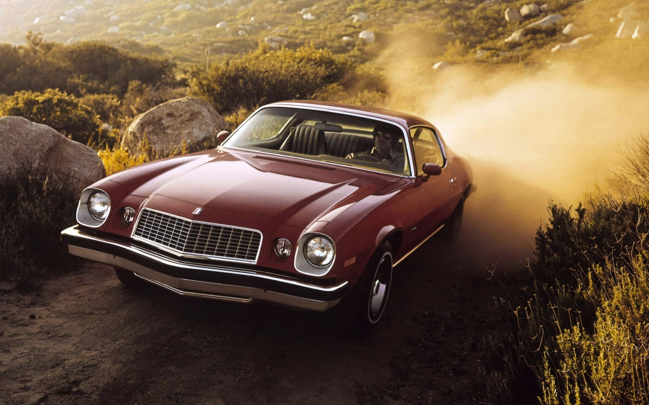 maroon, classic muscle car, sunlit rocky hillside landscape, 2K Desktop Wallpaper