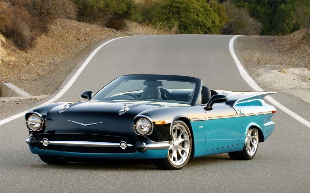 sleek black and turquoise convertible sports car, winding mountain road, lush green trees, HD Desktop Wallpaper