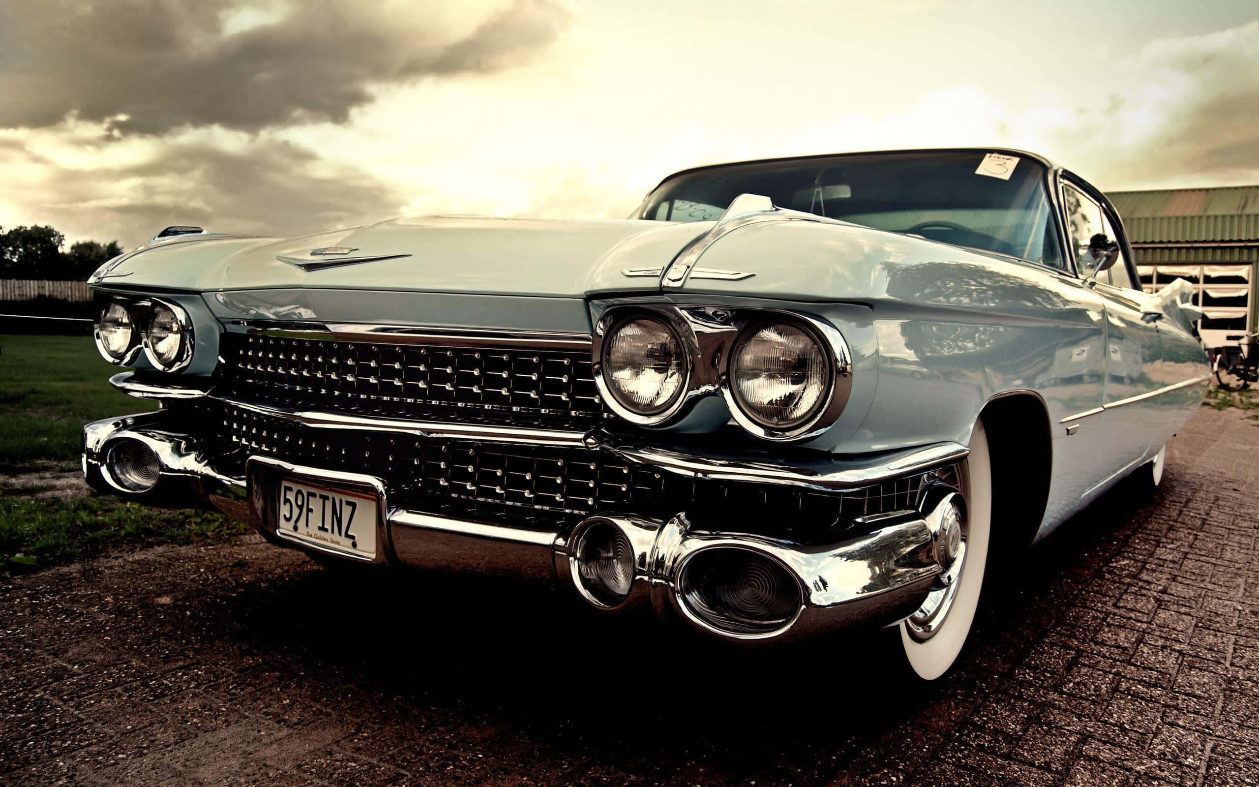 vintage light blue Cadillac, chrome details, dramatic cloudy sky, 2K Desktop Wallpaper