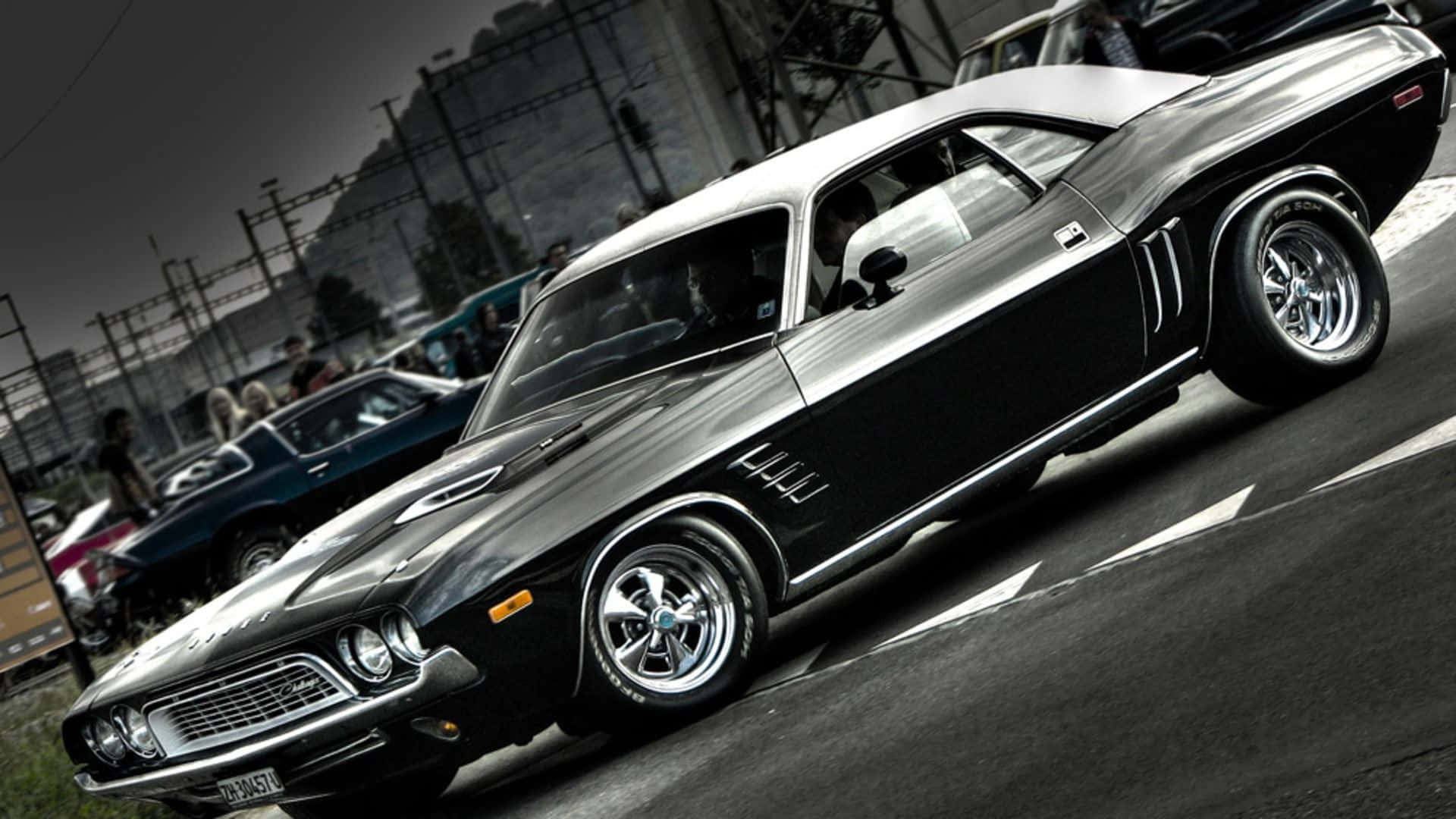 sleek black classic muscle car, chrome wheels, gritty urban street scene, Full HD Desktop Wallpaper