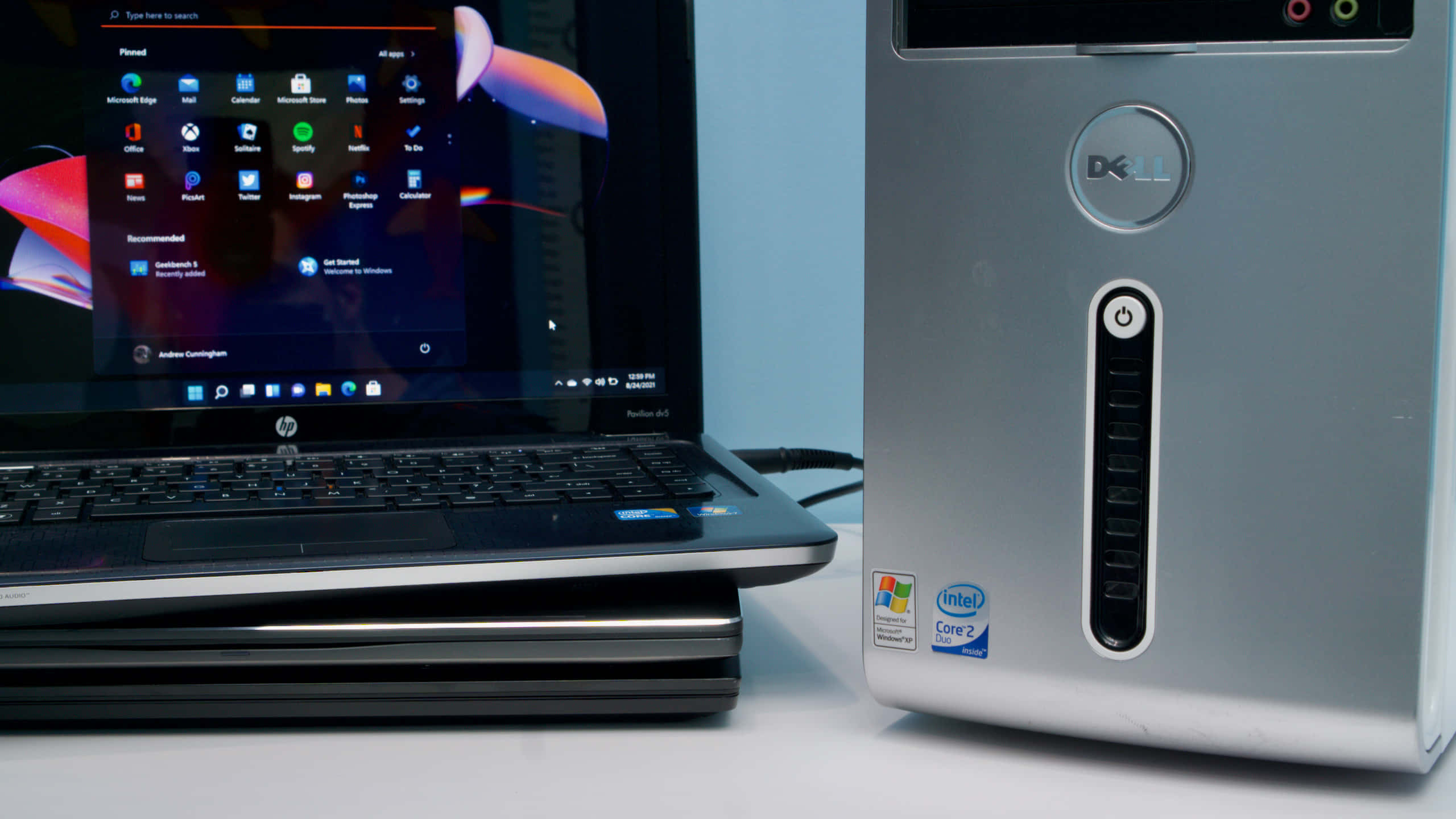 Dell desktop tower, HP laptop, Windows Start menu, 2K Desktop Wallpaper