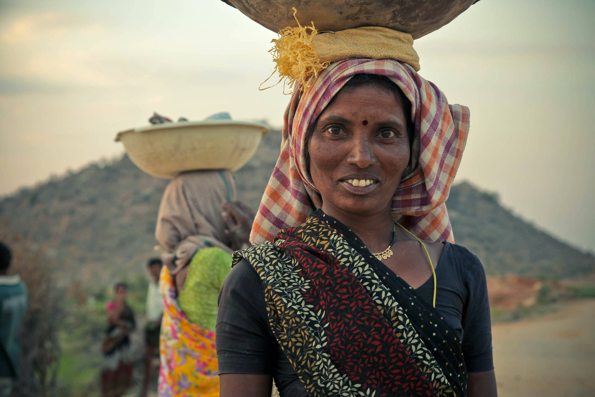 Indian Elderly Woman, large bowl, hazy mountain backdrop, Full HD Desktop Wallpaper