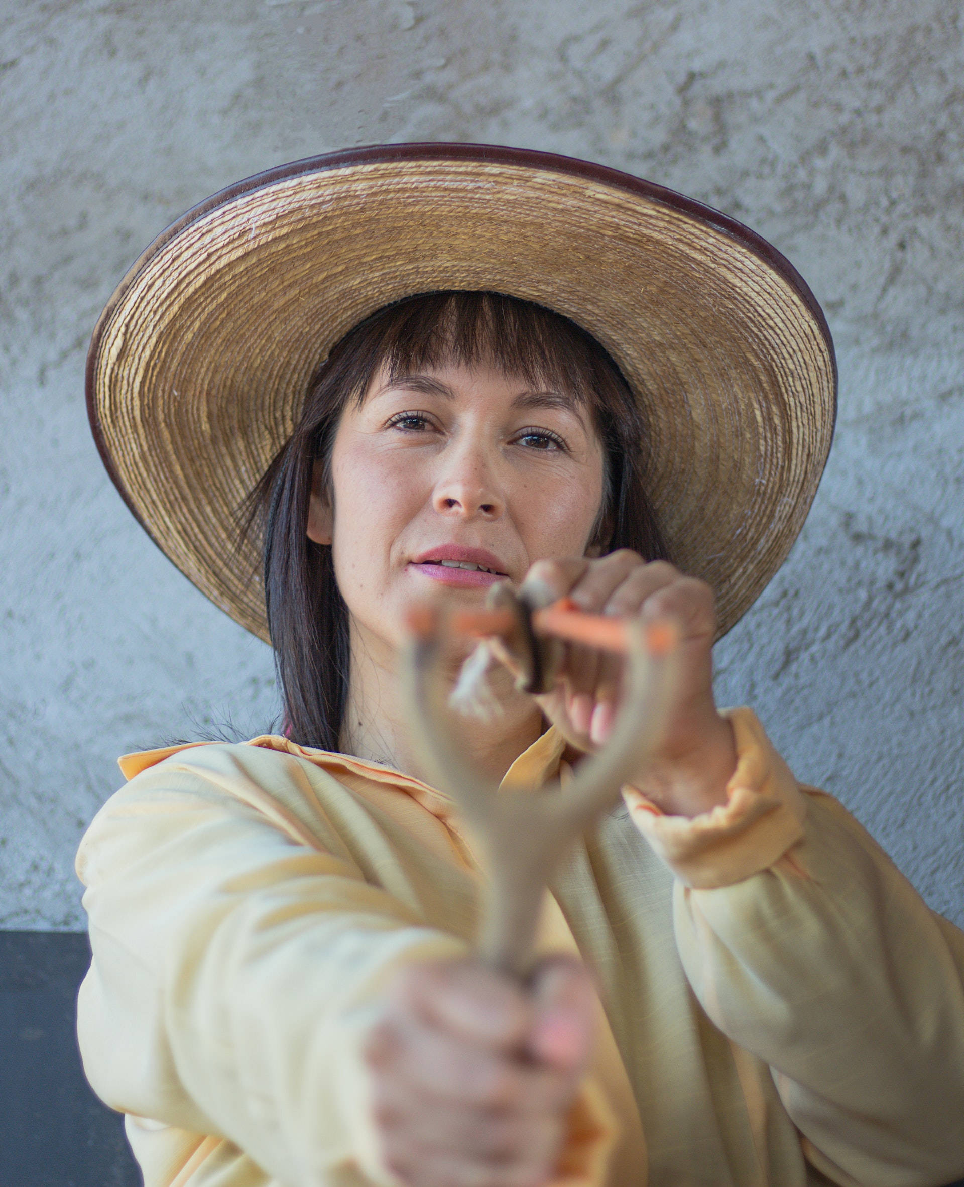 Older Woman Slingshot, straw hat, yellow shirt, Full HD Phone Wallpaper