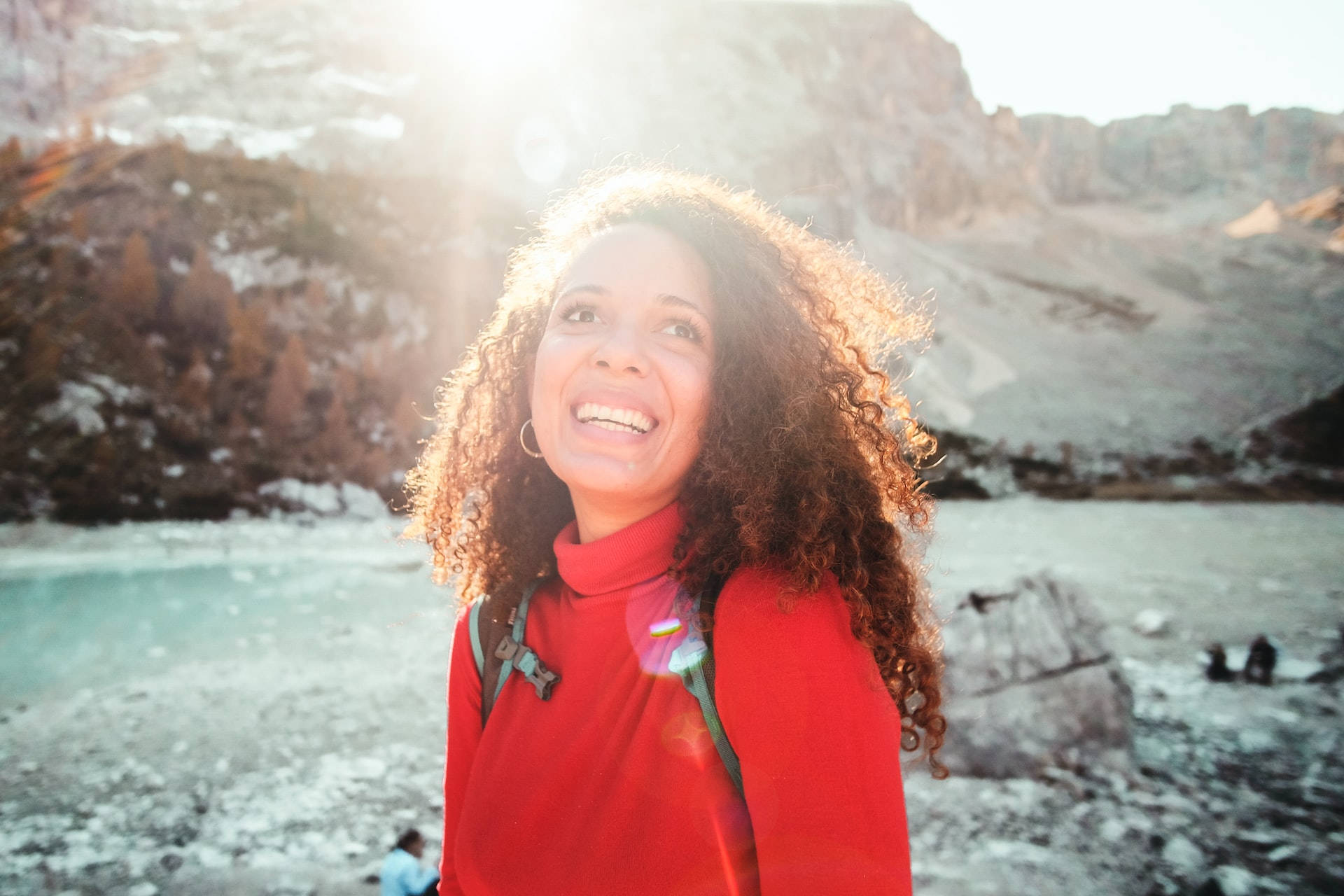 older woman, red sweater, sunlit mountain lake, Full HD Desktop Wallpaper