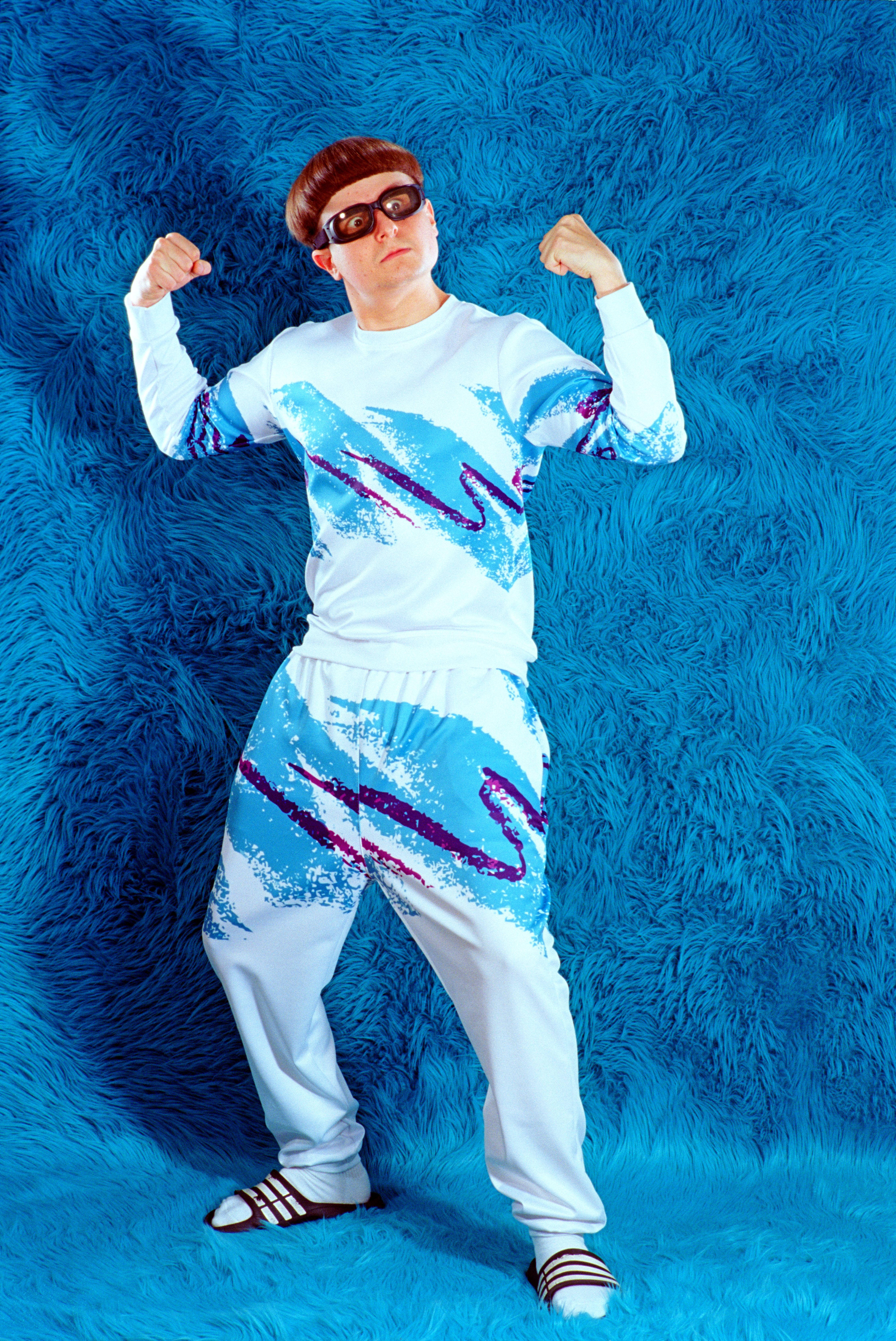 Oliver Tree, blue fur wall, white tracksuit, 5K Phone Wallpaper