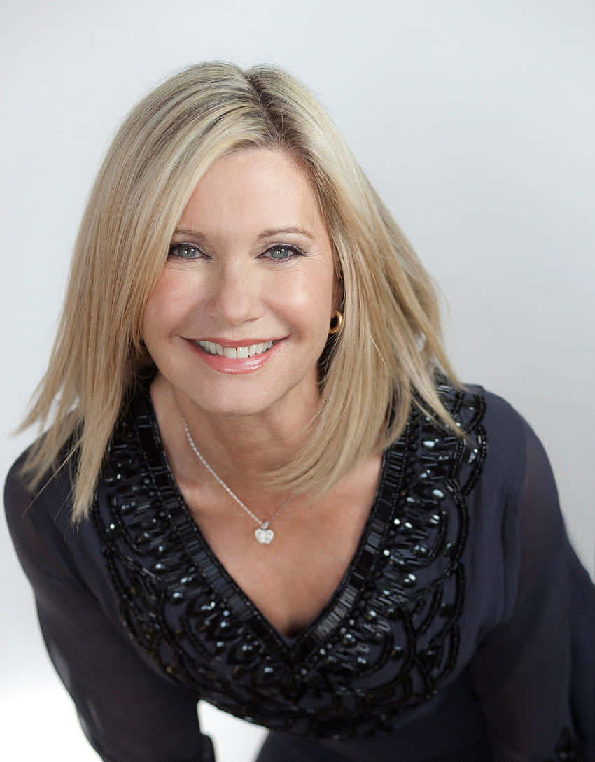 Olivia Newton John, black beaded top, heart necklace, SD Phone Wallpaper