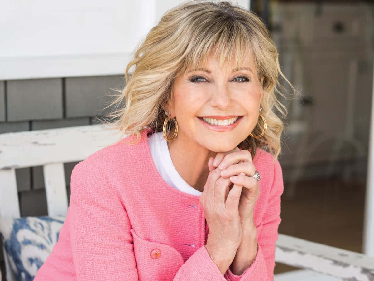 Olivia Newton John, blonde hair, pink jacket, SD Desktop Wallpaper