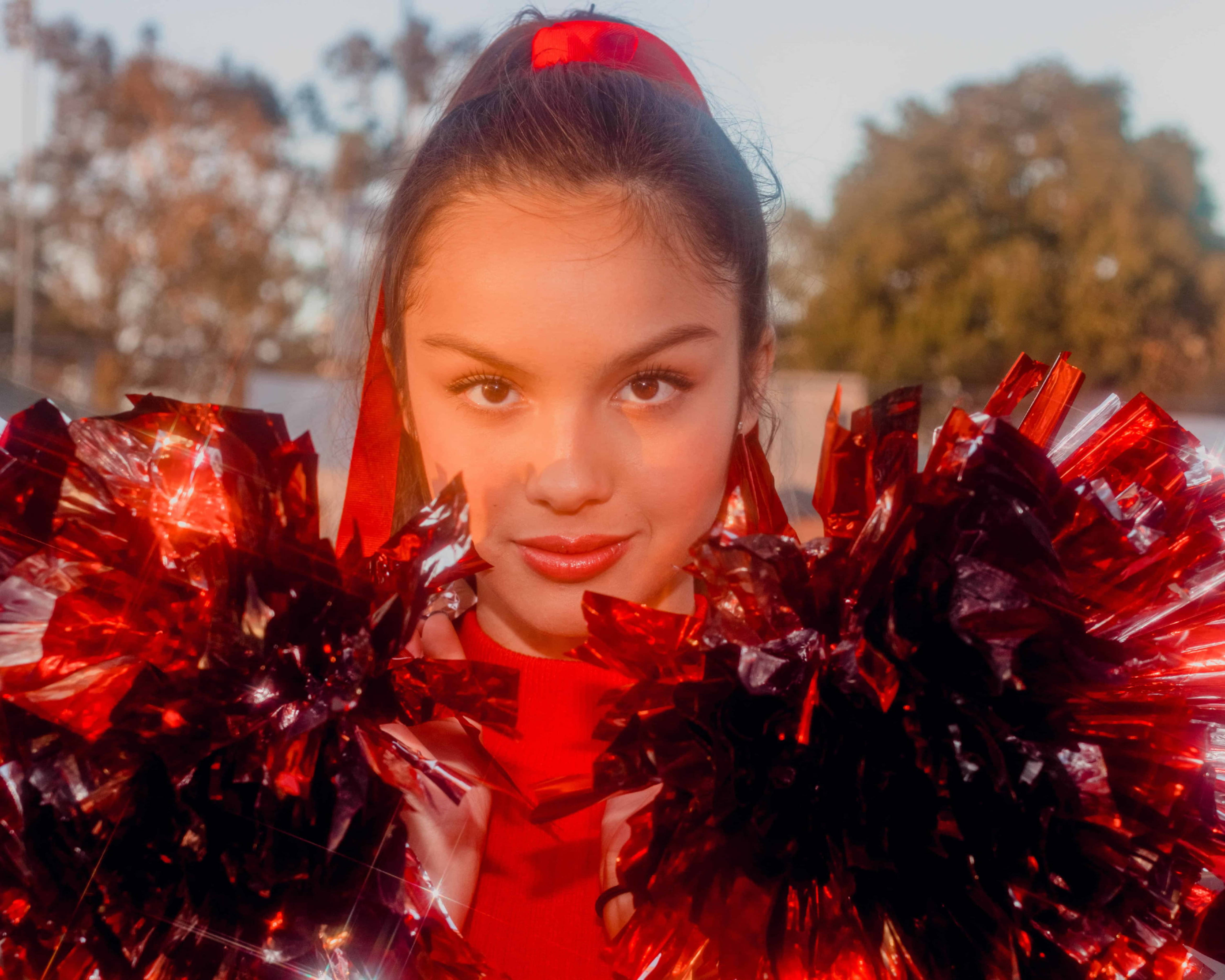 Olivia Rodrigo, red pom-poms, headband, 5K Desktop Wallpaper
