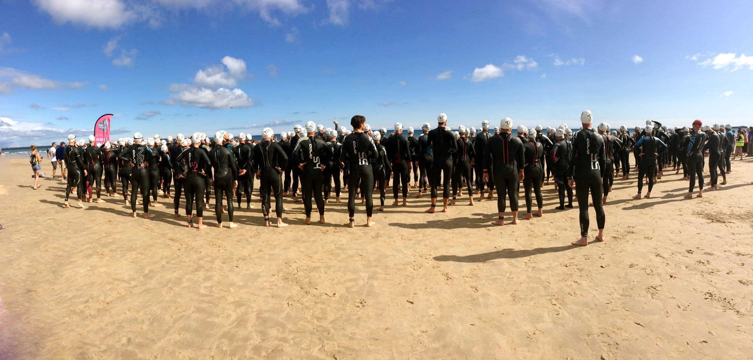 triathlon athletes, black wetsuits, white swim caps, 2K Desktop Wallpaper
