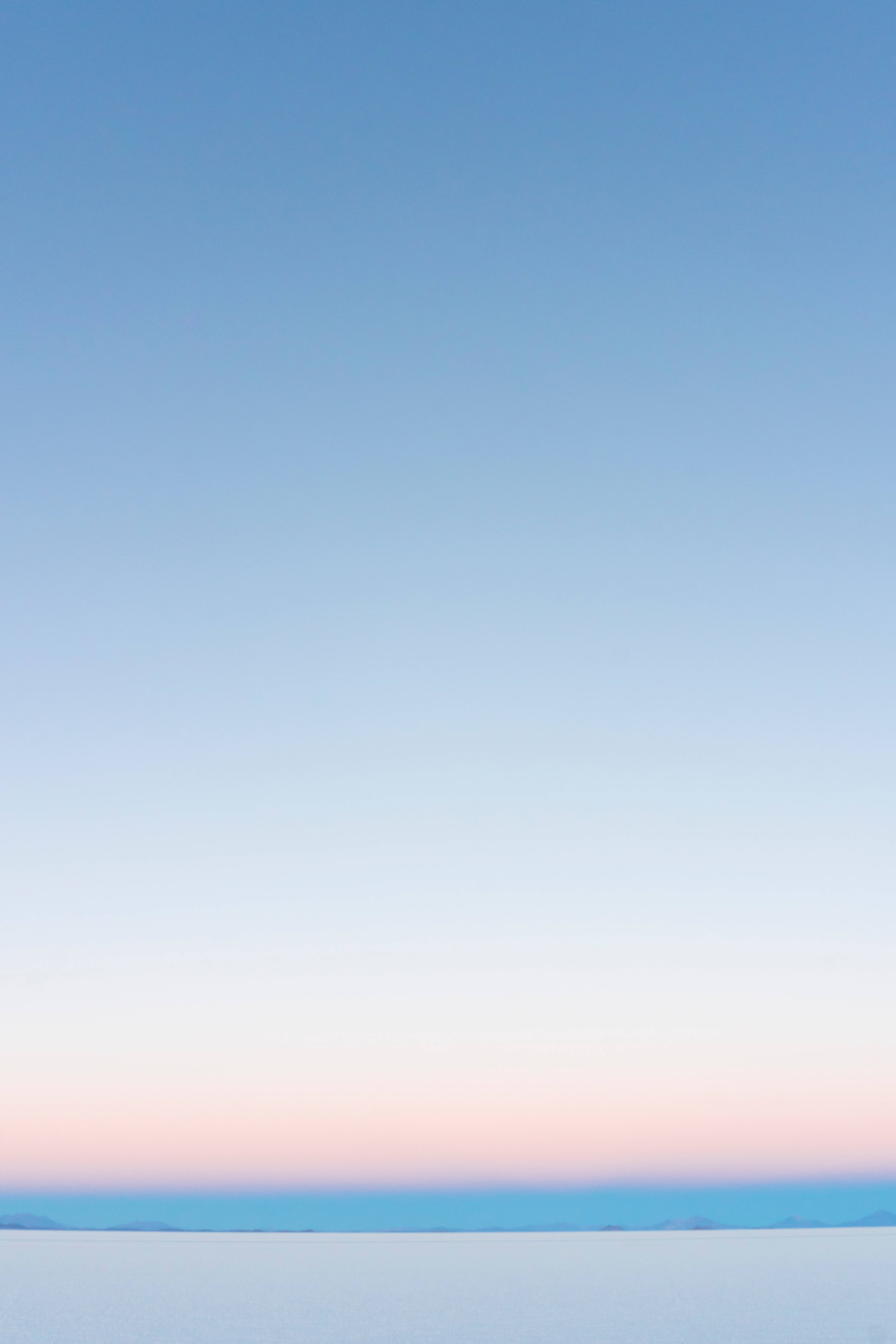 sunny blue ombre sky, soft pink to blue gradient, calm horizon line, 5K Phone Wallpaper