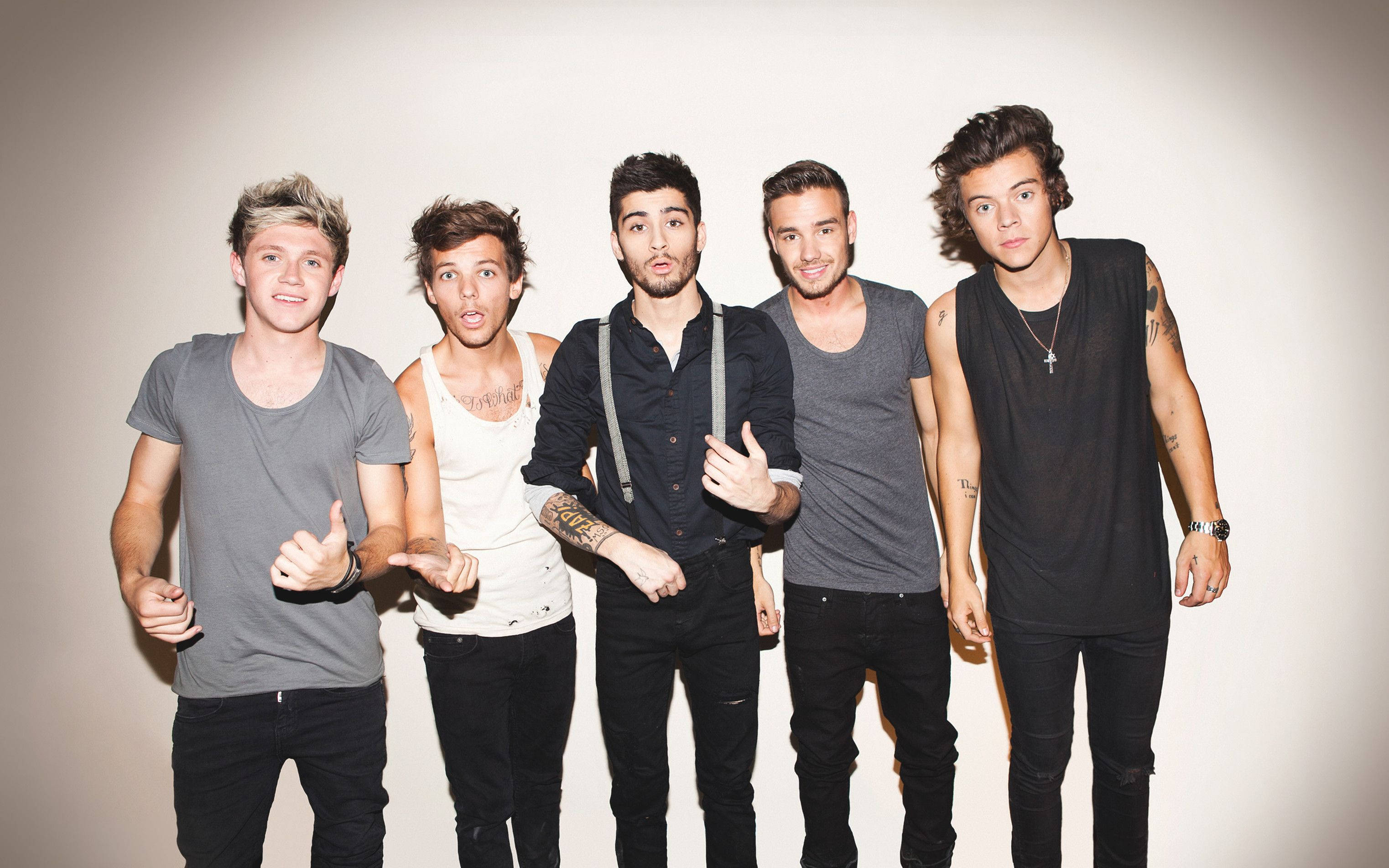 One Direction, dark clothing, light gray studio backdrop, 2K Desktop Wallpaper