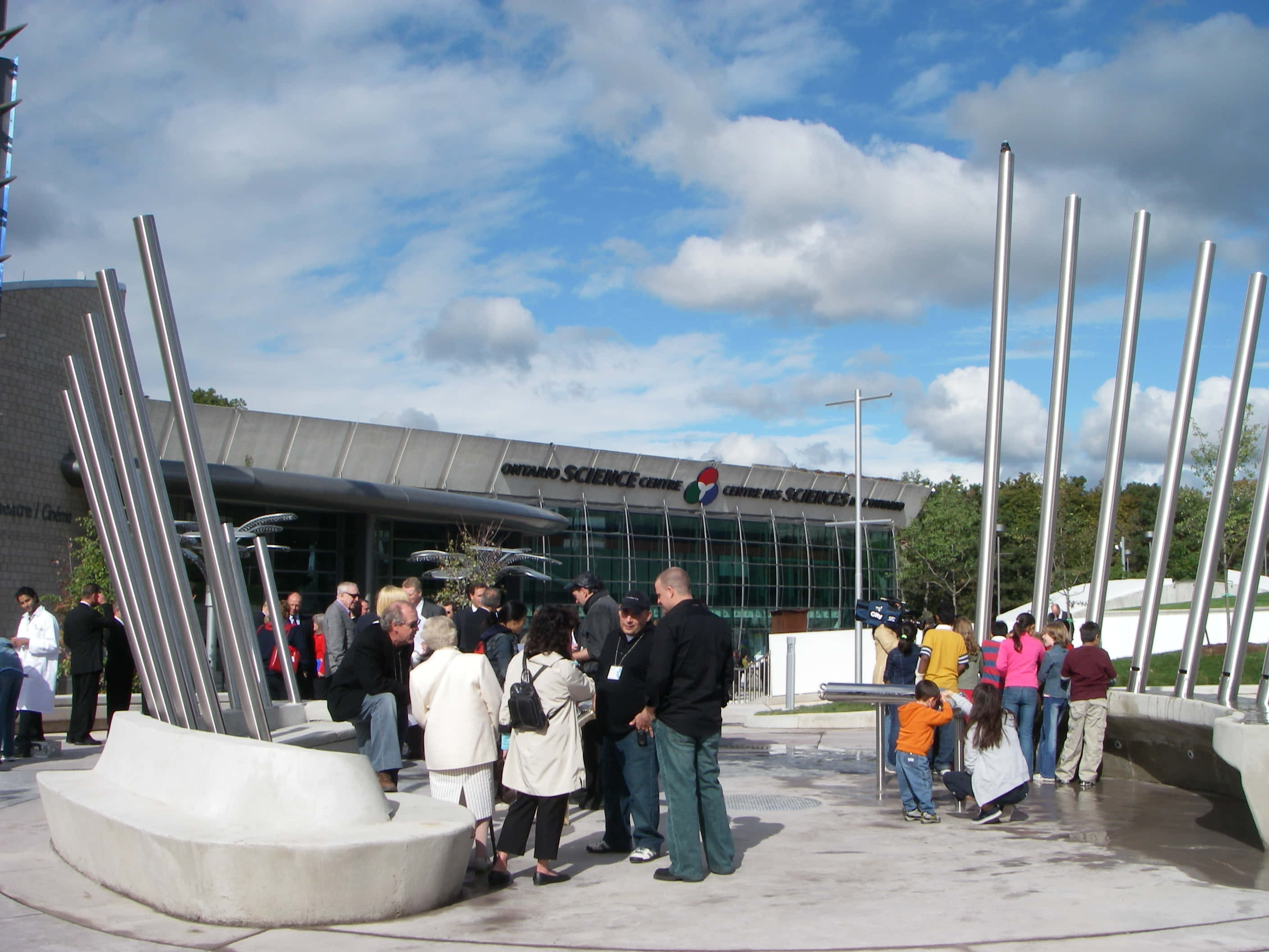 Ontario Science Centre, bright blue sky, fluffy white clouds, 2K Desktop Wallpaper