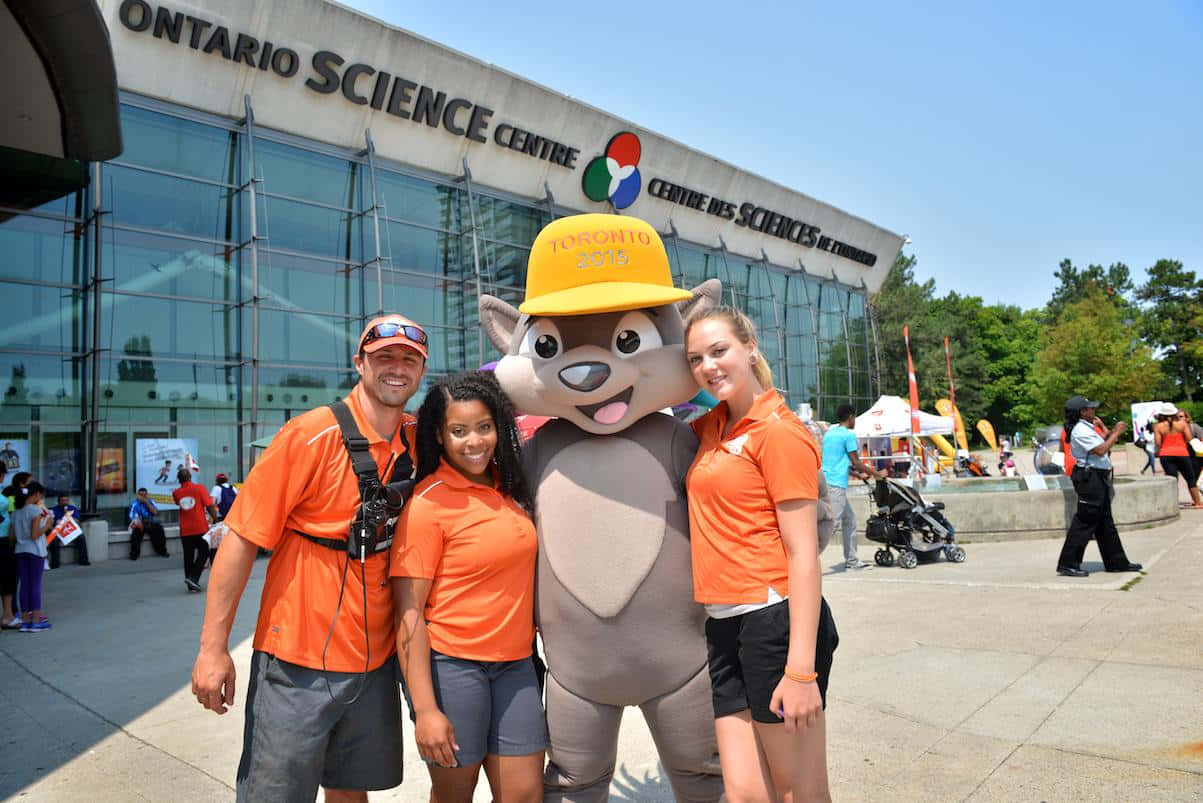 Ontario Science Centre, orange shirts, grey squirrel mascot, SD Desktop Wallpaper