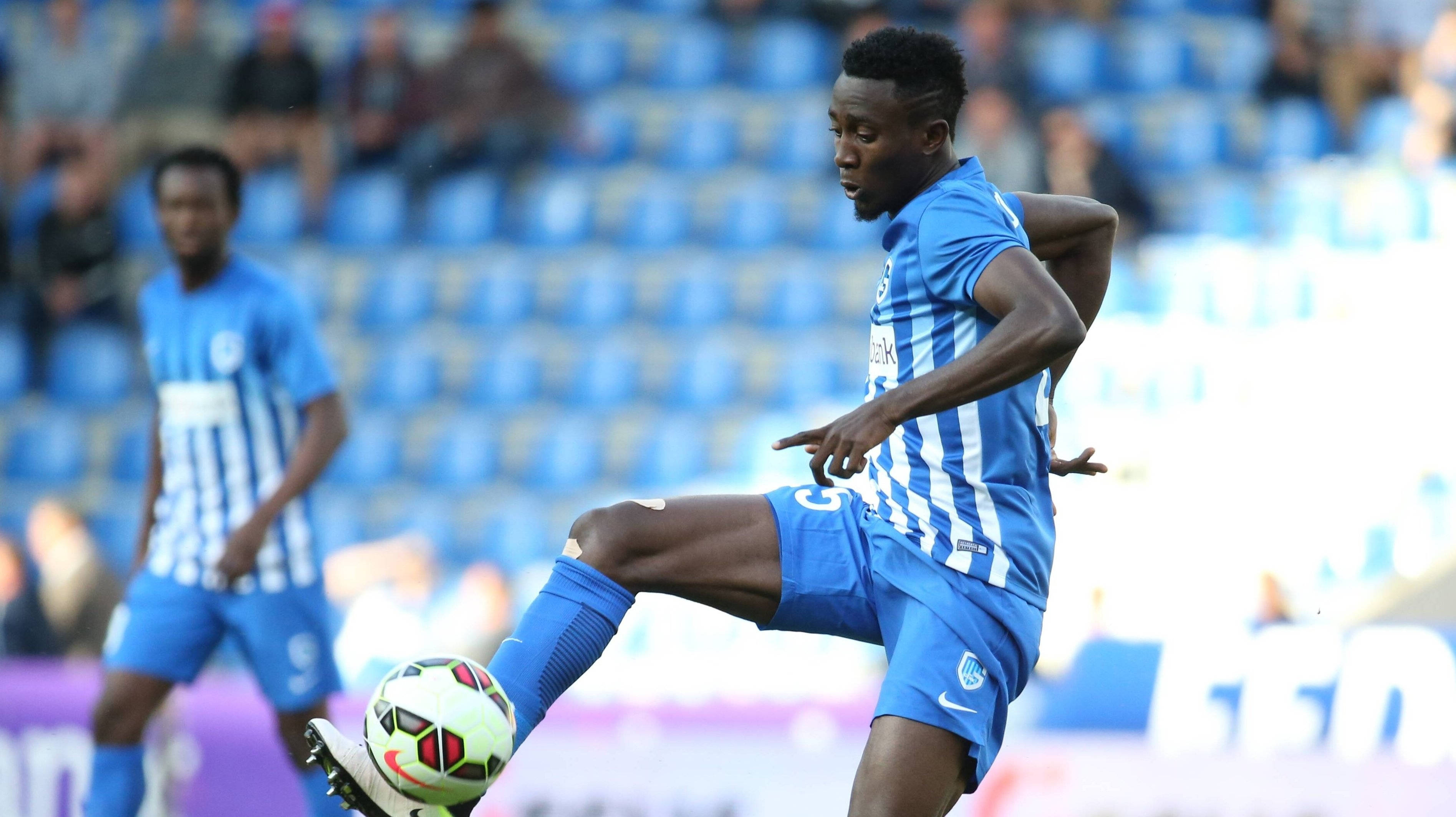 Onyinye Ndidi, blue and white stripes, sunlit stadium field, 2K Desktop Wallpaper