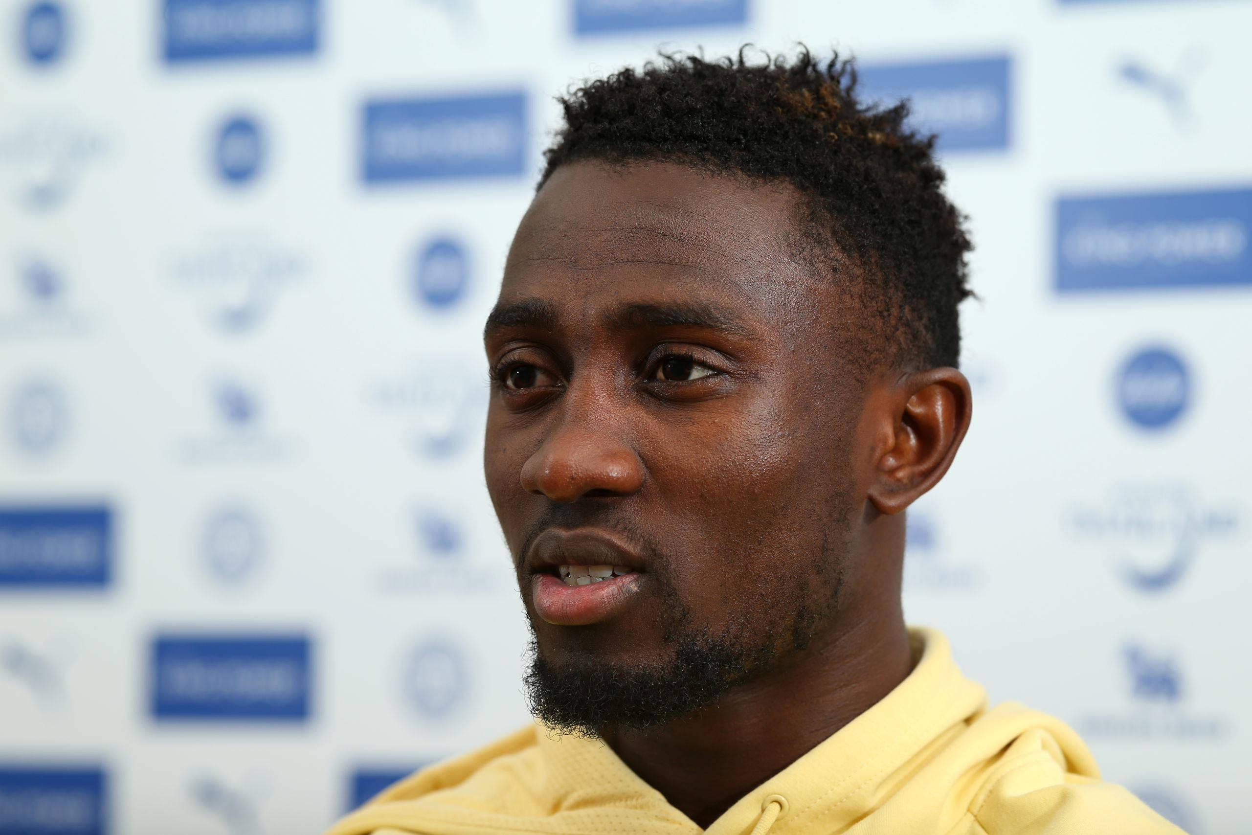 Onyinye Ndidi, yellow hoodie, branded backdrop, 2K Desktop Wallpaper