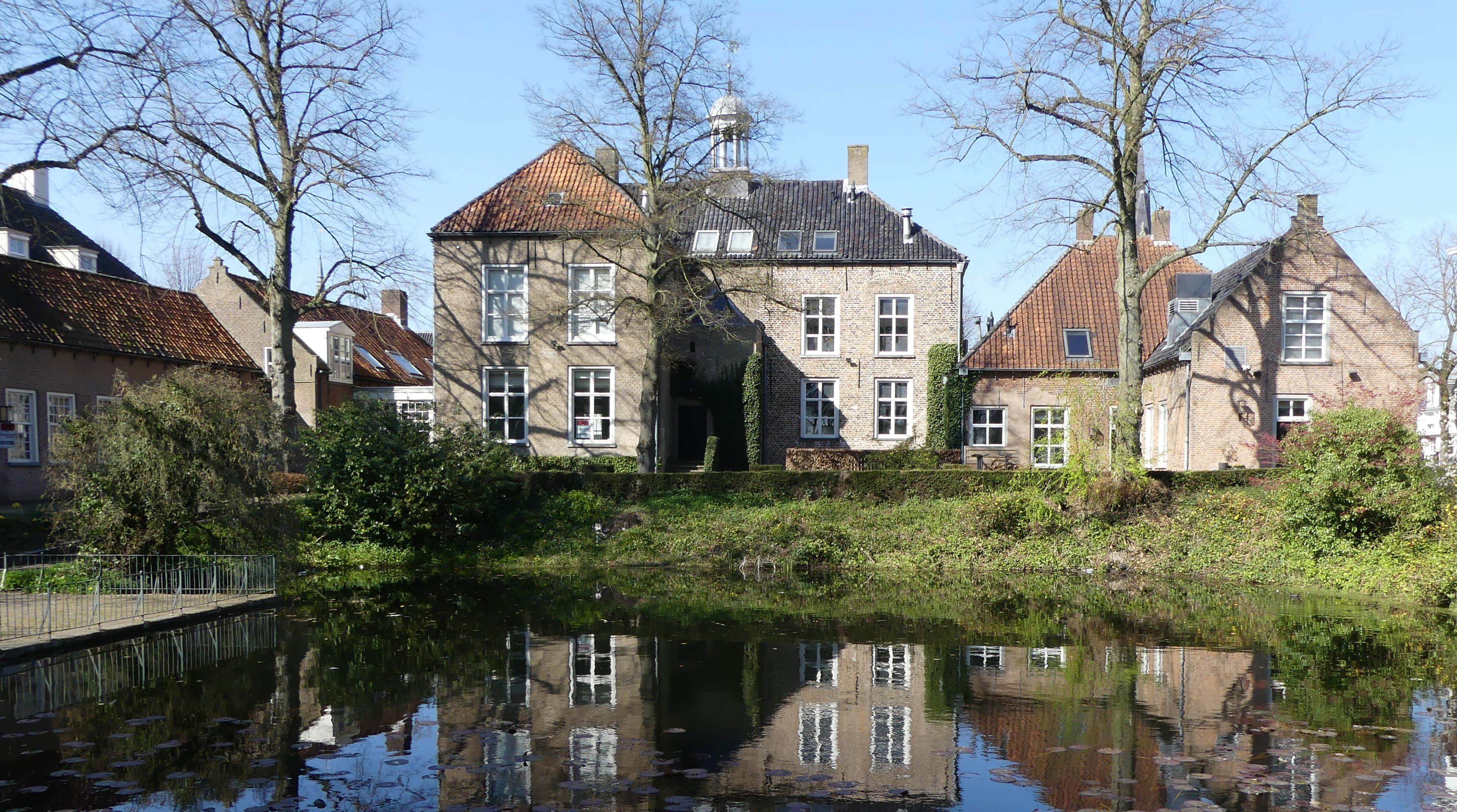 Oosterhout, historic stone buildings, red tile roofs, 2K Desktop Wallpaper