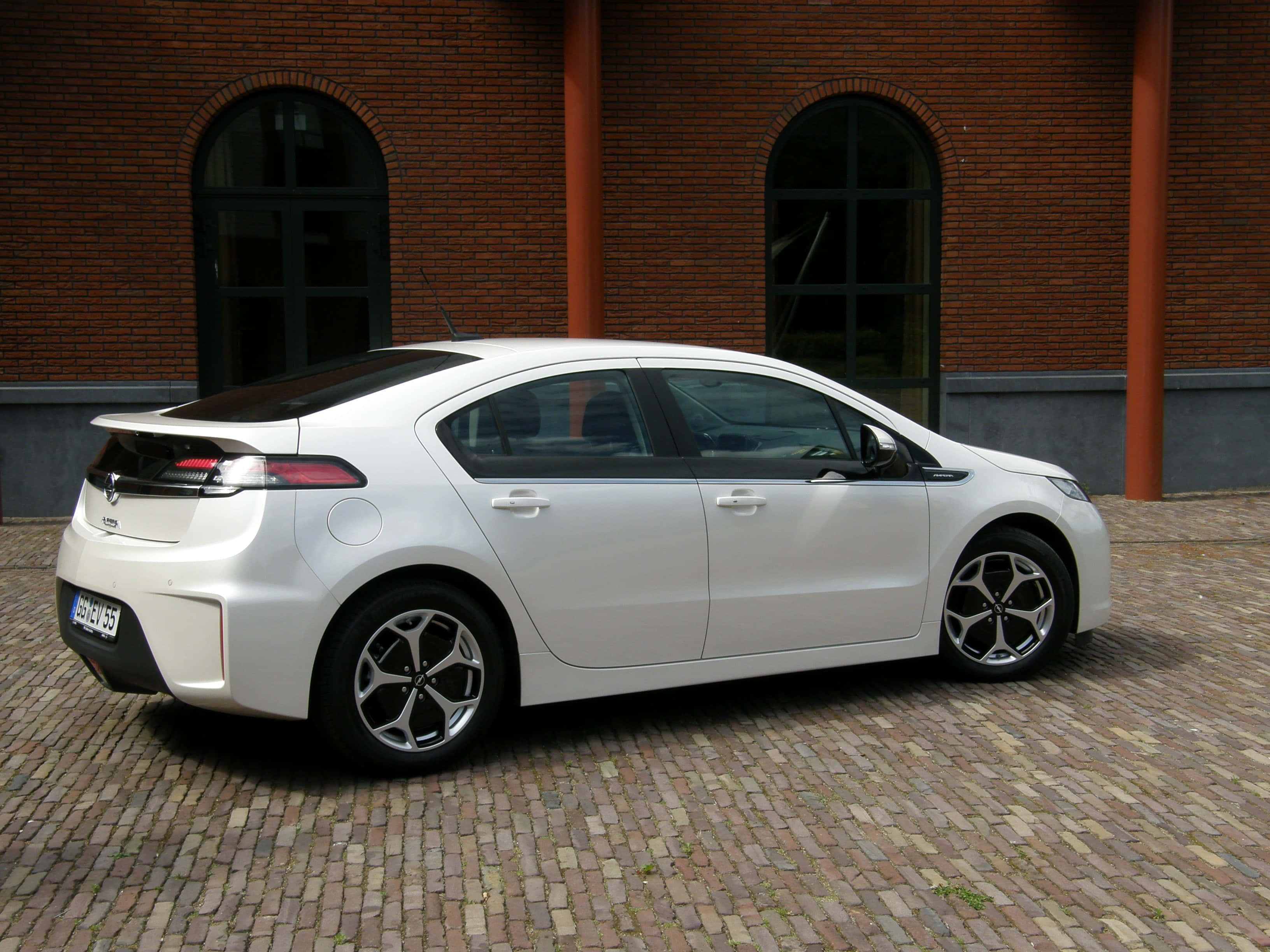 Opel Ampera, white, cobblestone courtyard, 2K Desktop Wallpaper