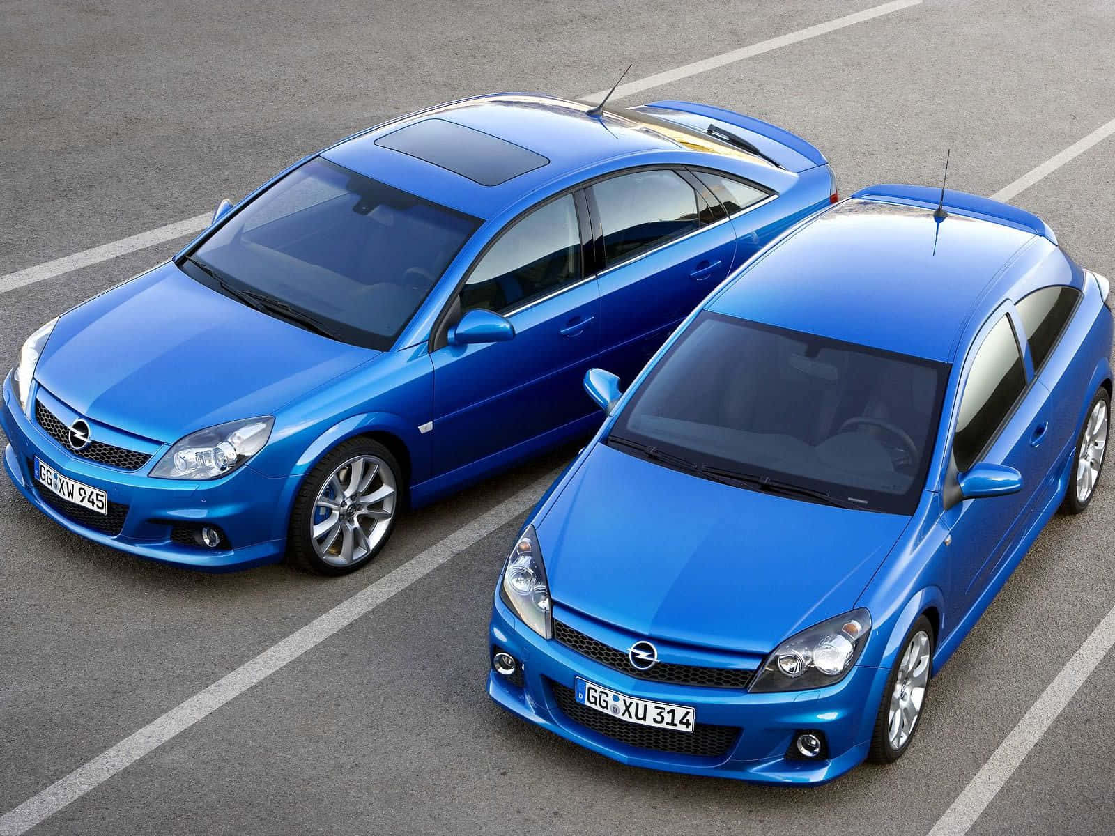 Opel Astra, glossy blue, gray asphalt lot, HD Desktop Wallpaper