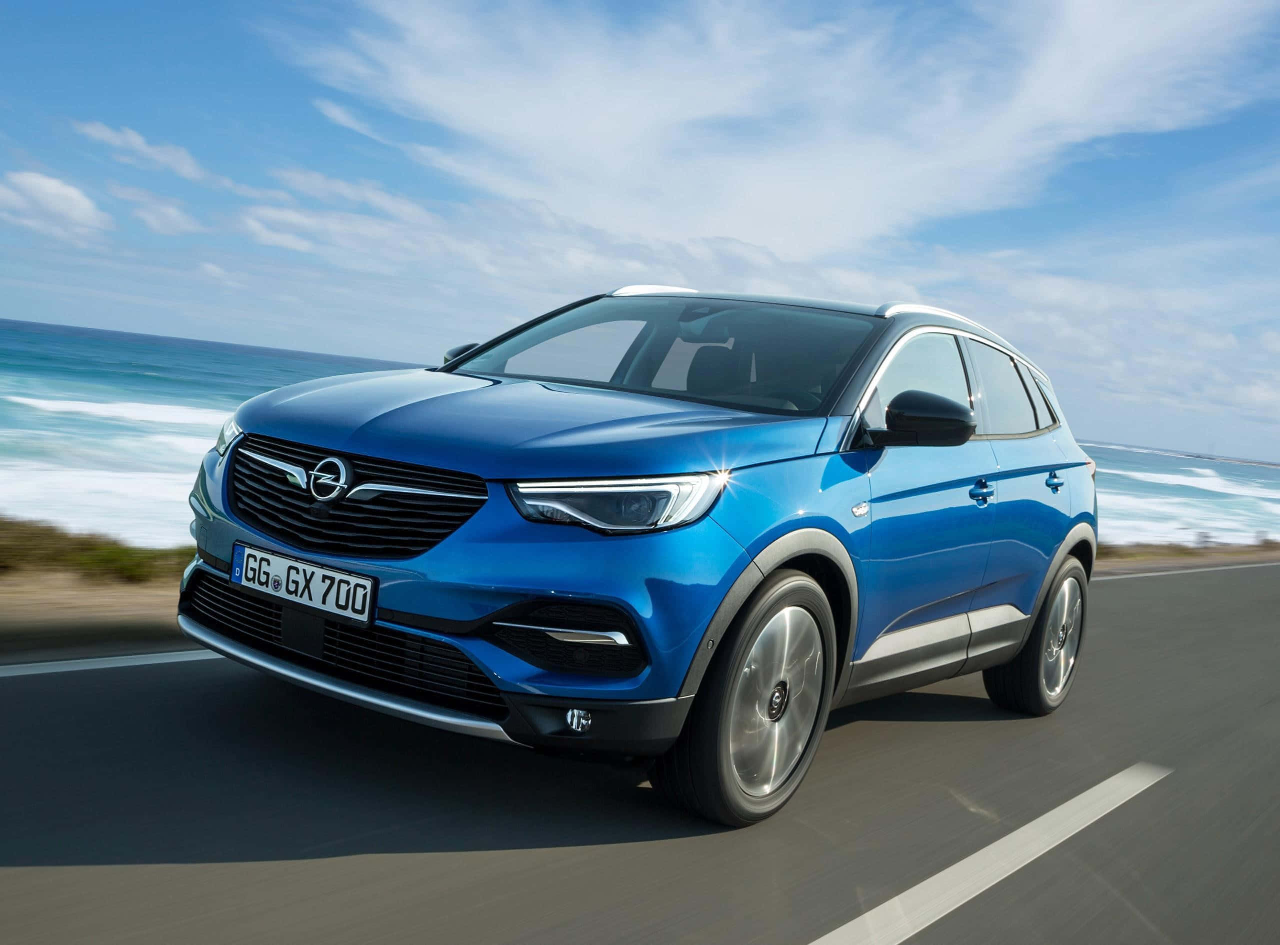 Opel Grandland X, vibrant blue, coastal road, 2K Desktop Wallpaper
