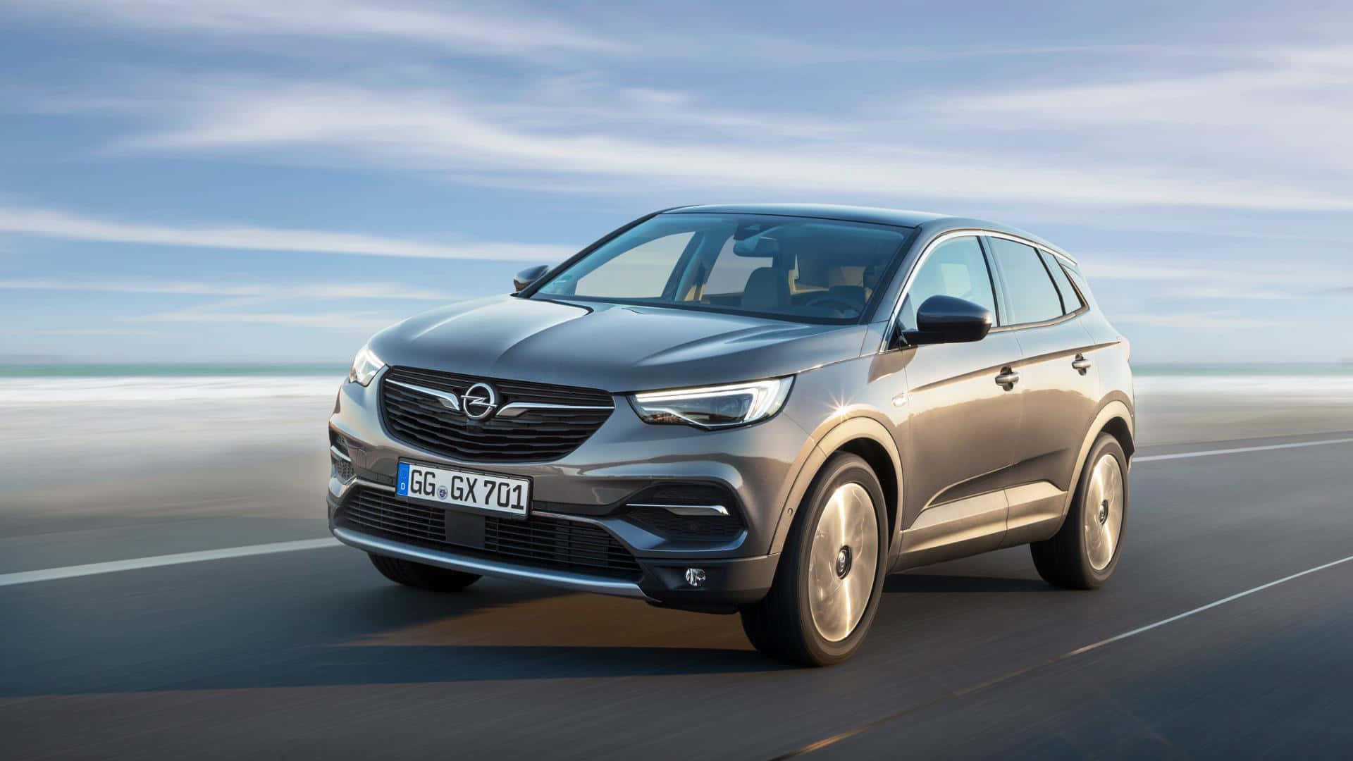 Opel Grandland X, sleek silver SUV, coastal road, Full HD Desktop Wallpaper