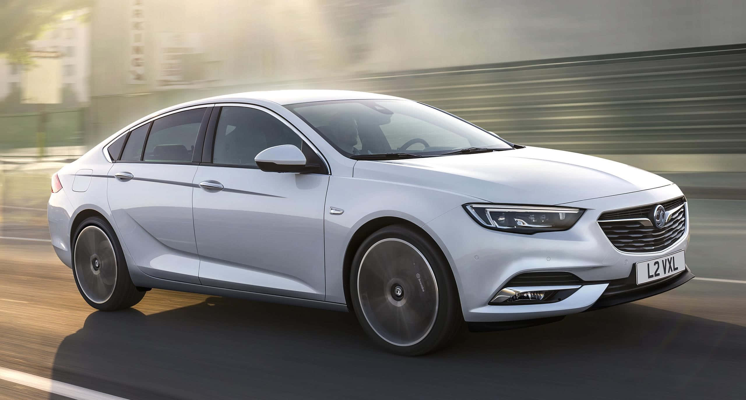 Opel Insignia, sleek silver sedan, urban road, 2K Desktop Wallpaper