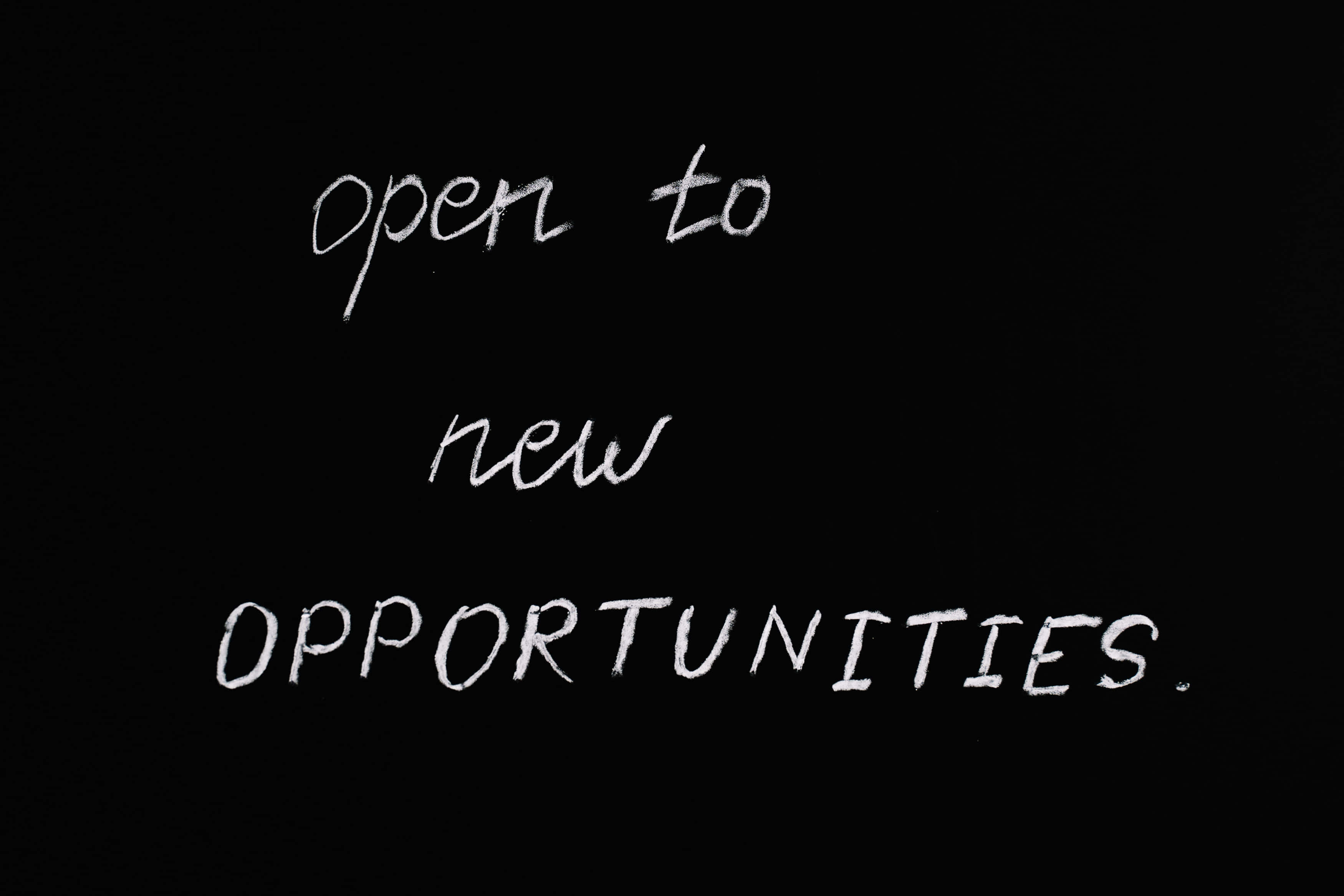 open to new opportunities, white chalk text, stark black background, 2K Desktop Wallpaper