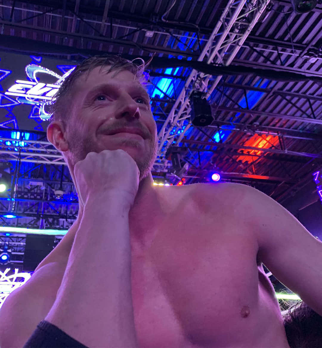 Orange Cassidy, vibrant purple and blue stage lights, wrestling event, SD Phone Wallpaper