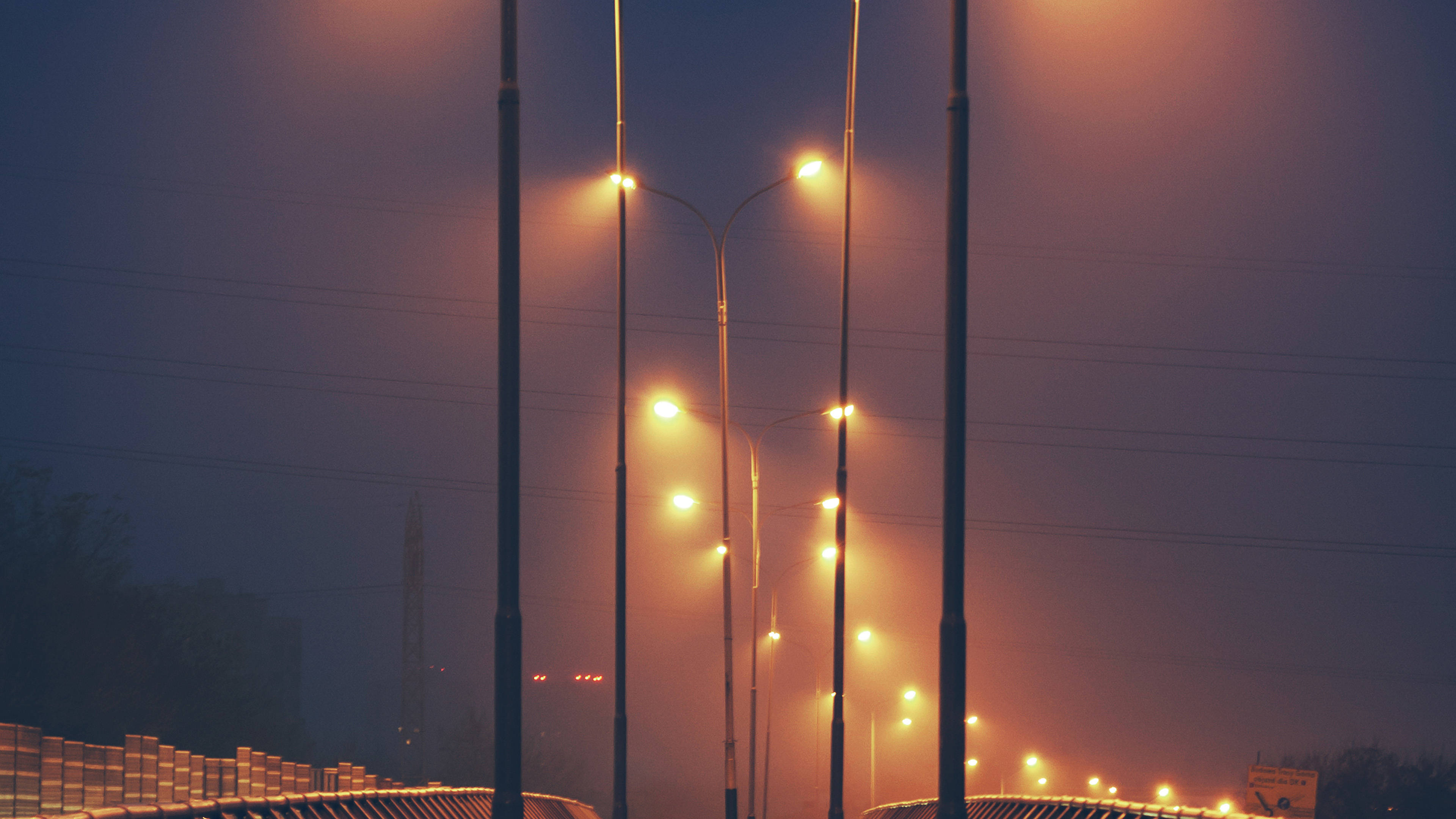 Orange City, glowing streetlights, warm amber hues, 4K Desktop Wallpaper