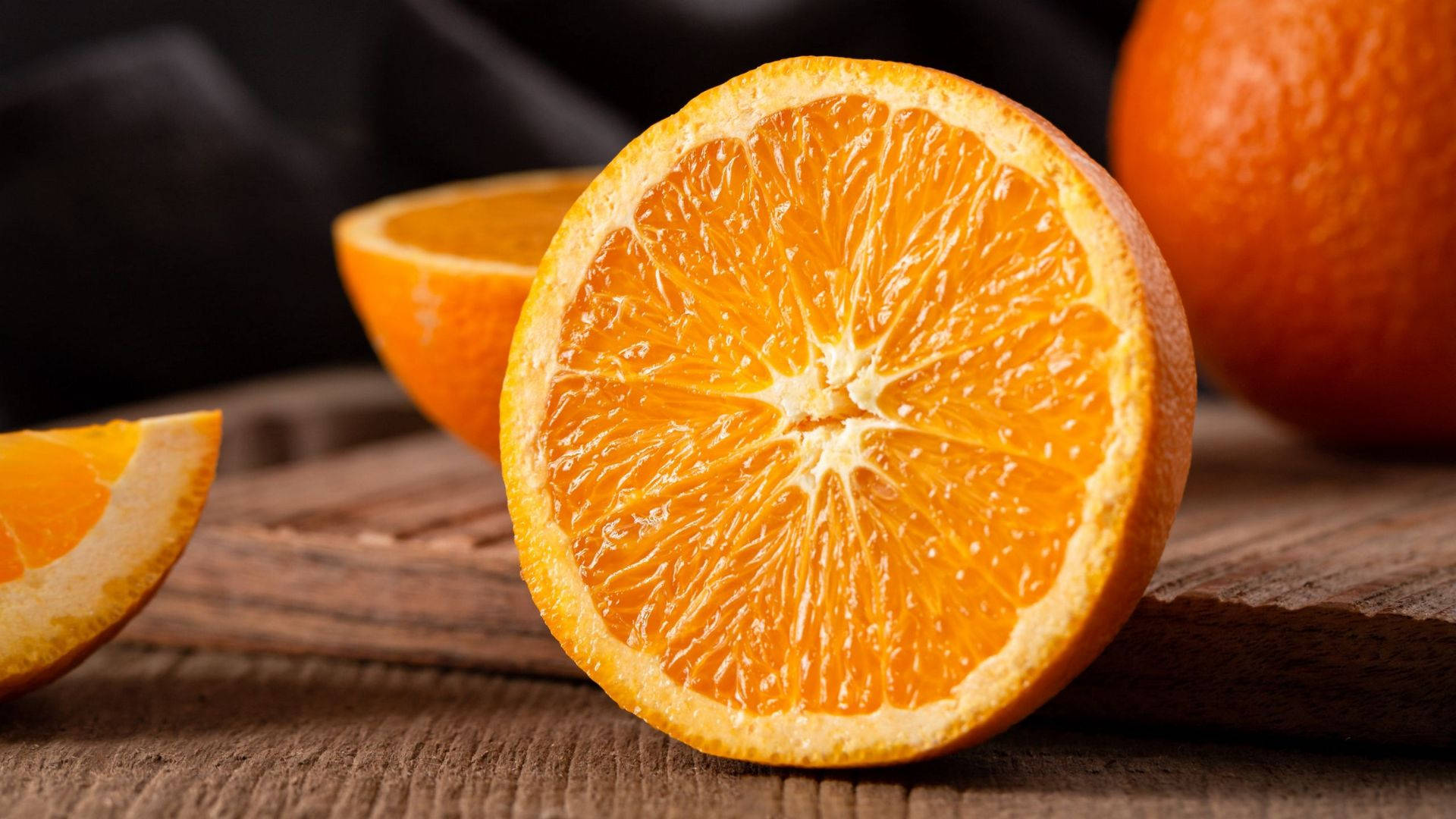 sliced orange fruit, juicy segments, rustic wooden surface, Full HD Desktop Wallpaper