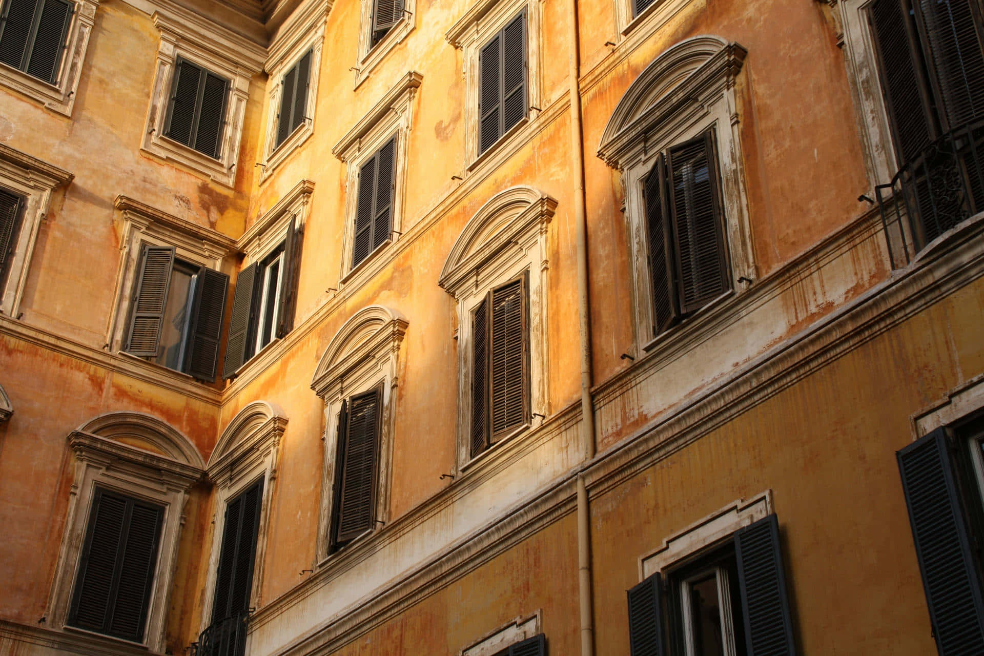 Orange Grunge Aesthetic, warm golden light, weathered ochre facade, Full HD Desktop Wallpaper