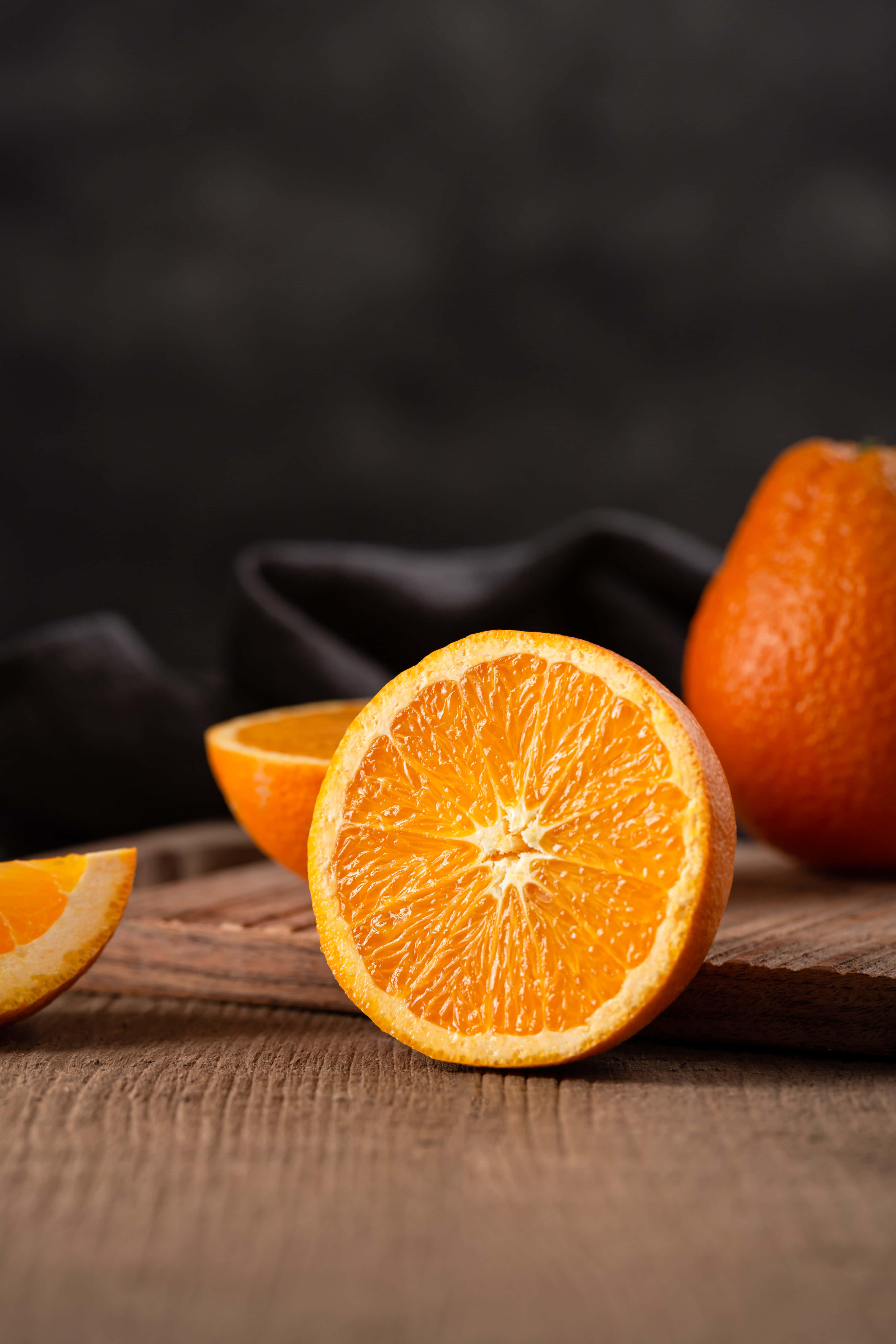 Orange iPhone, halved orange, juicy segments, 5K Phone Wallpaper