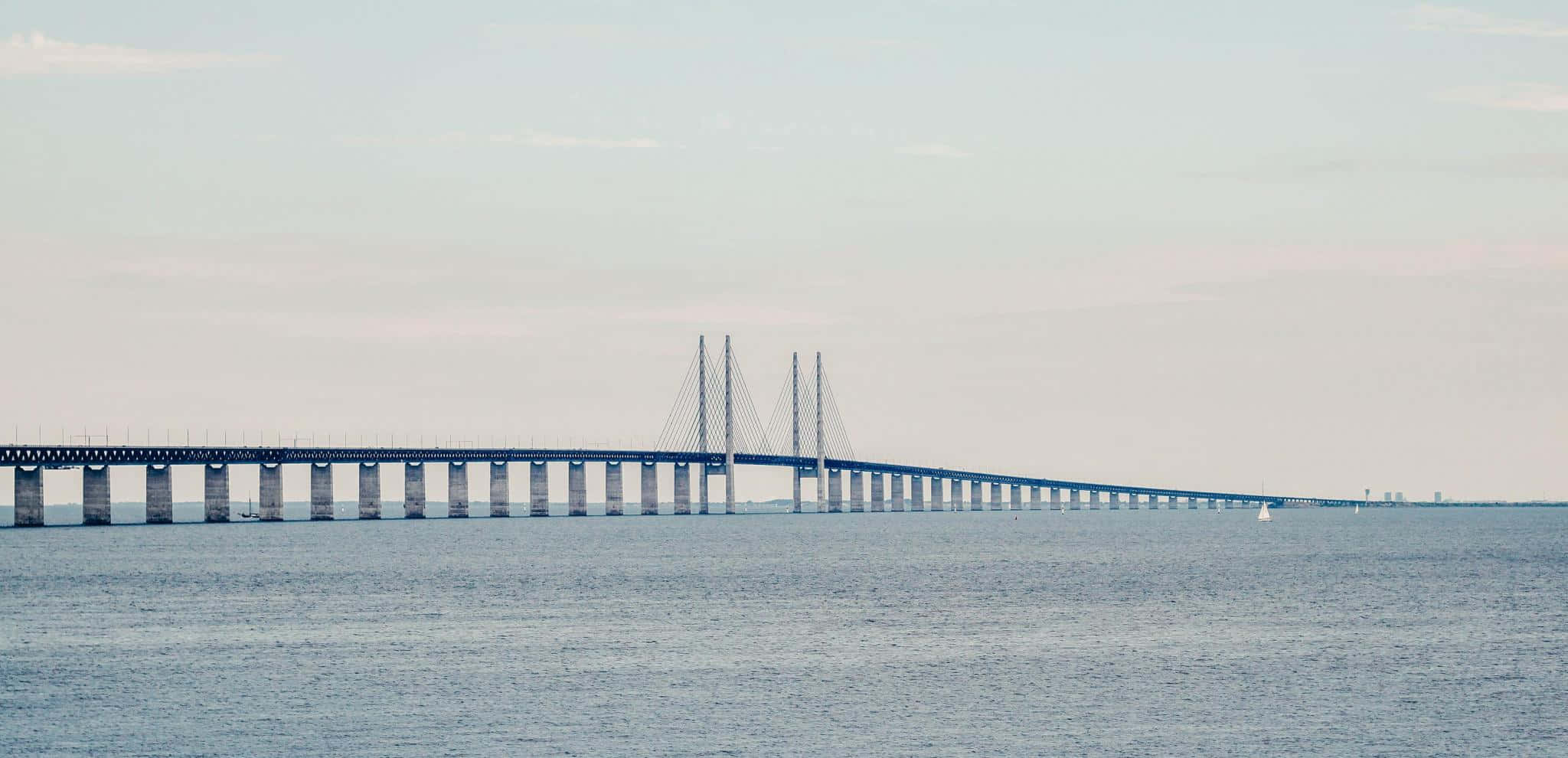 Oresund Bridge, blue cable-stayed bridge, calm ocean waters, Full HD Desktop Wallpaper