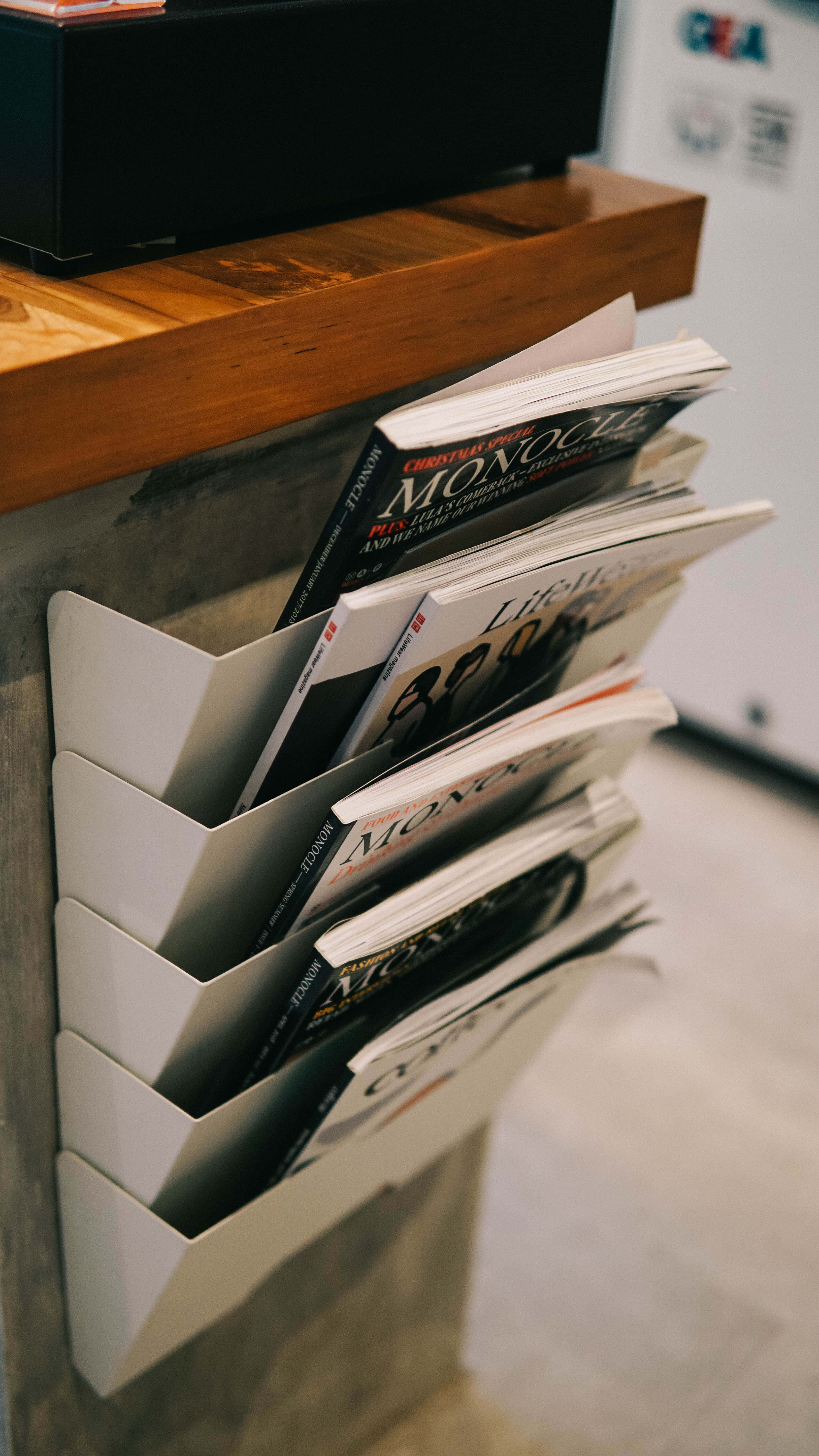 white magazine rack, wooden shelf, minimalist interior, 5K Phone Wallpaper