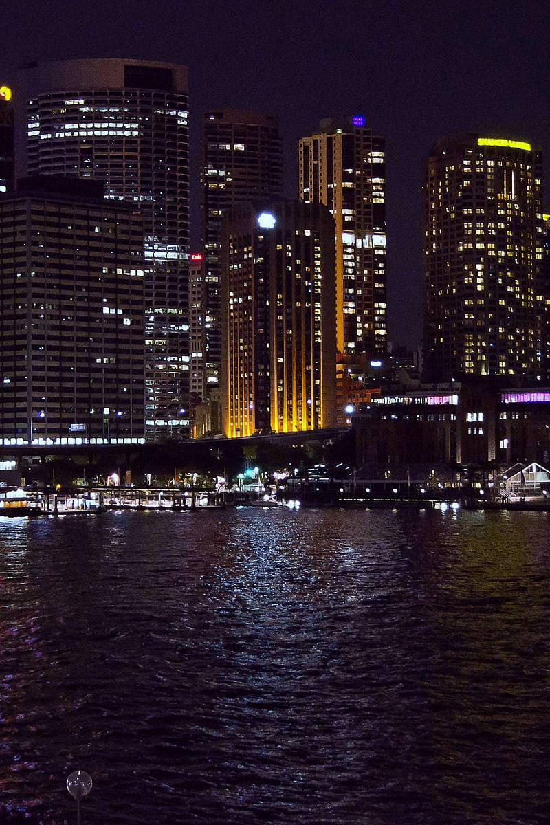 Original iPhone 4, city skyscrapers, warm yellow lights, SD Phone Wallpaper