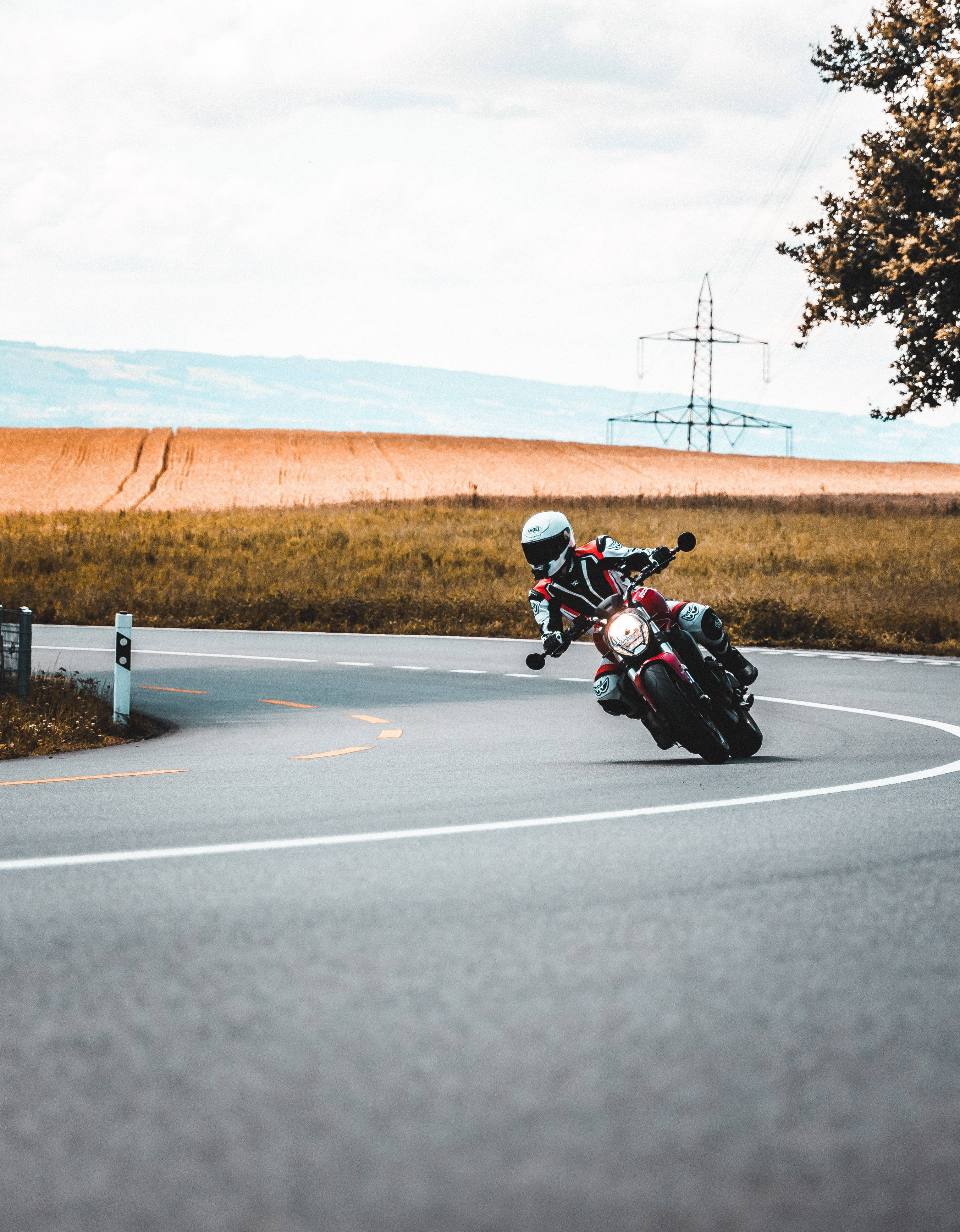 Original iPhone, motorcycle rider, rural road, 2K Phone Wallpaper