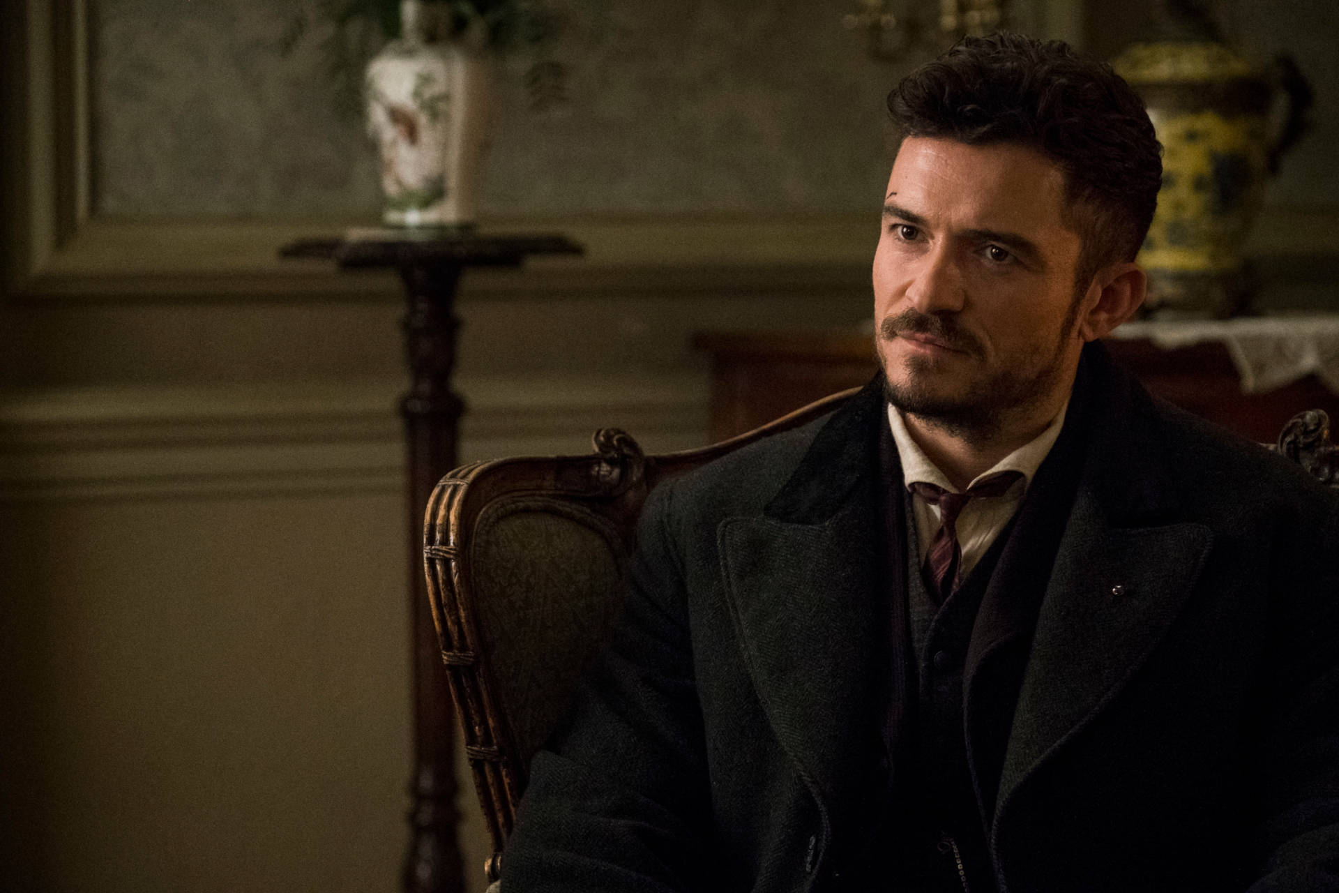 Orlando Bloom, dark coat, ornate chair, Full HD Desktop Wallpaper