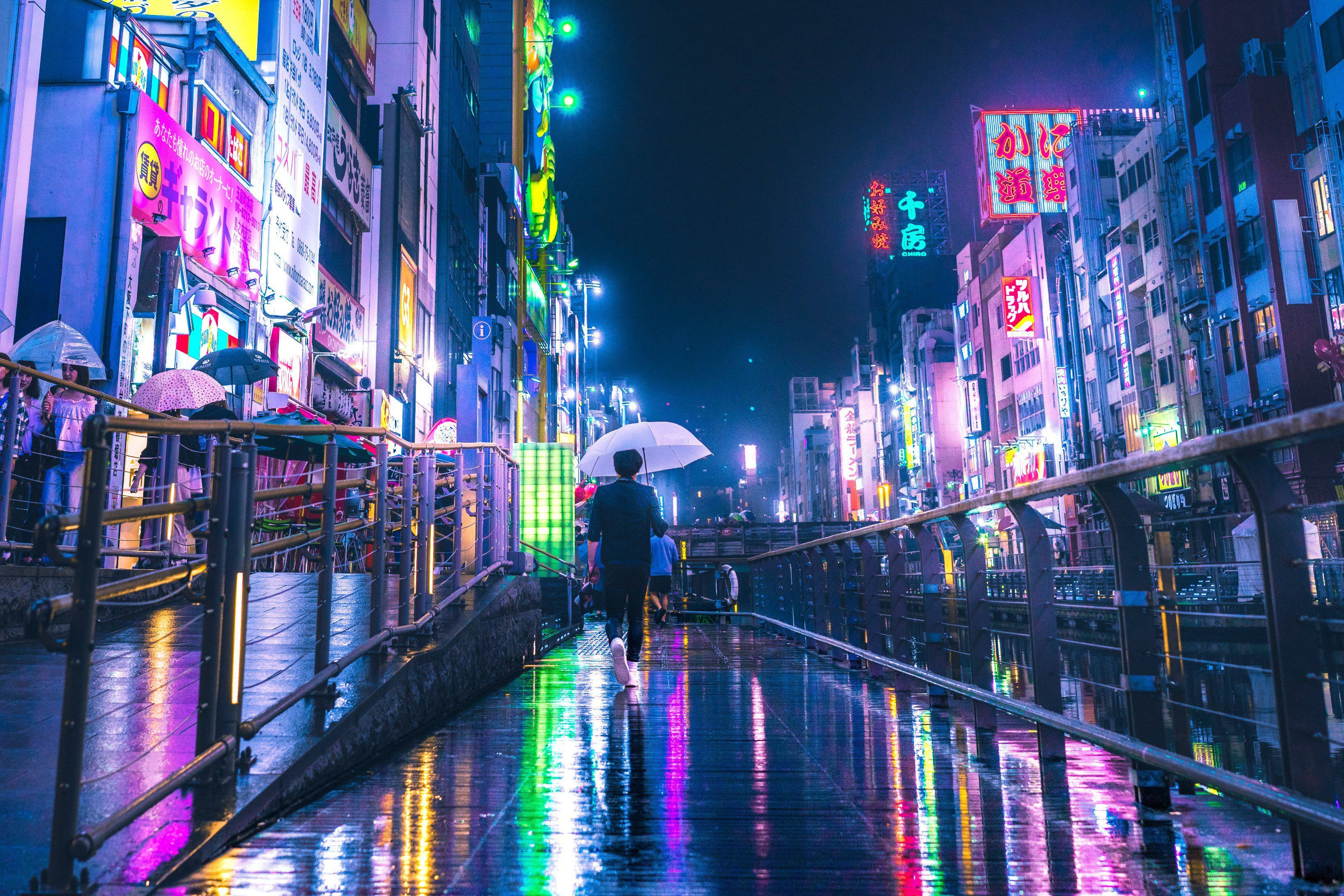 Osaka, rain-slicked neon-lit city bridge, night, 2K Desktop Wallpaper