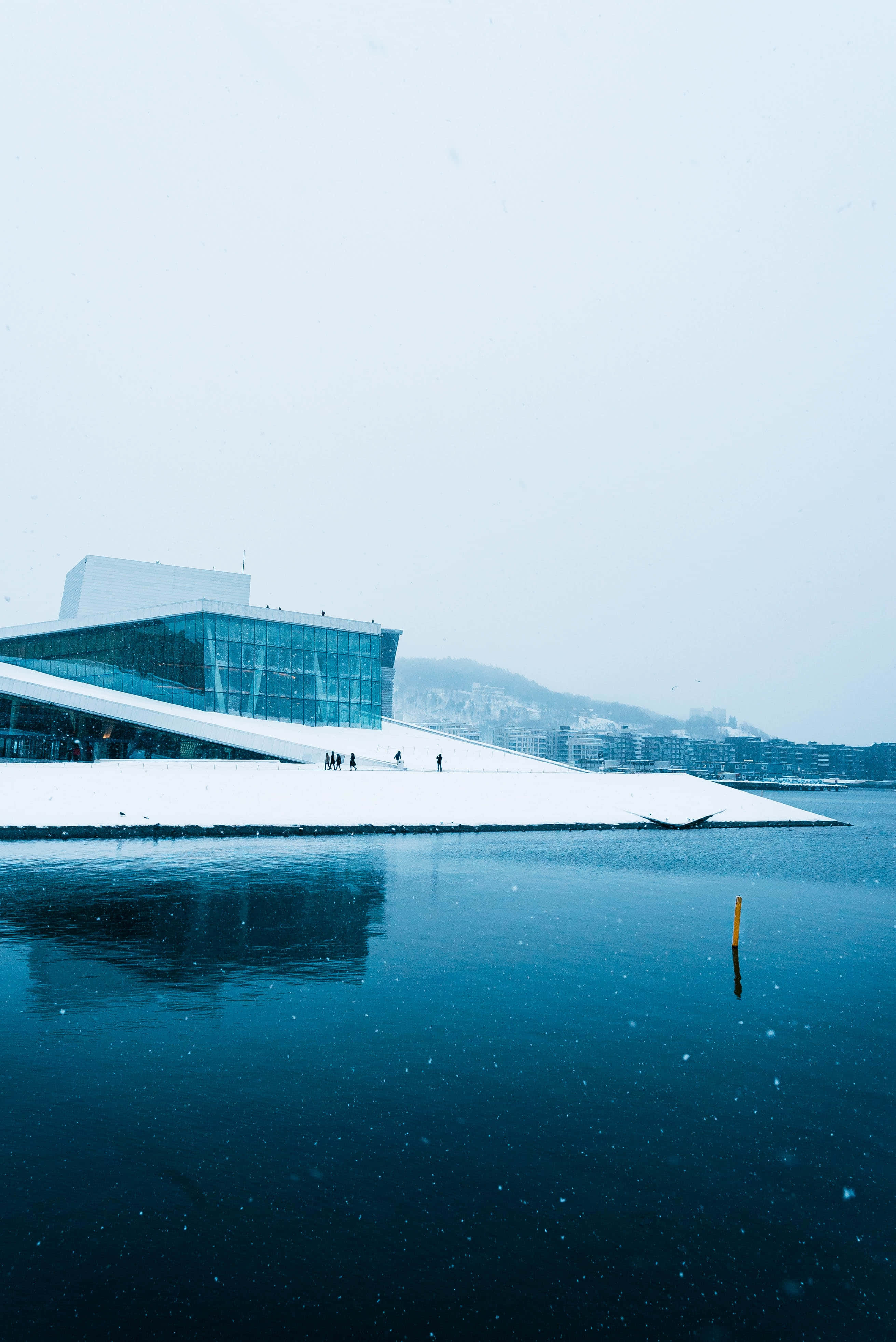 Oslo Opera House, snow-covered, calm blue water, 4K Phone Wallpaper