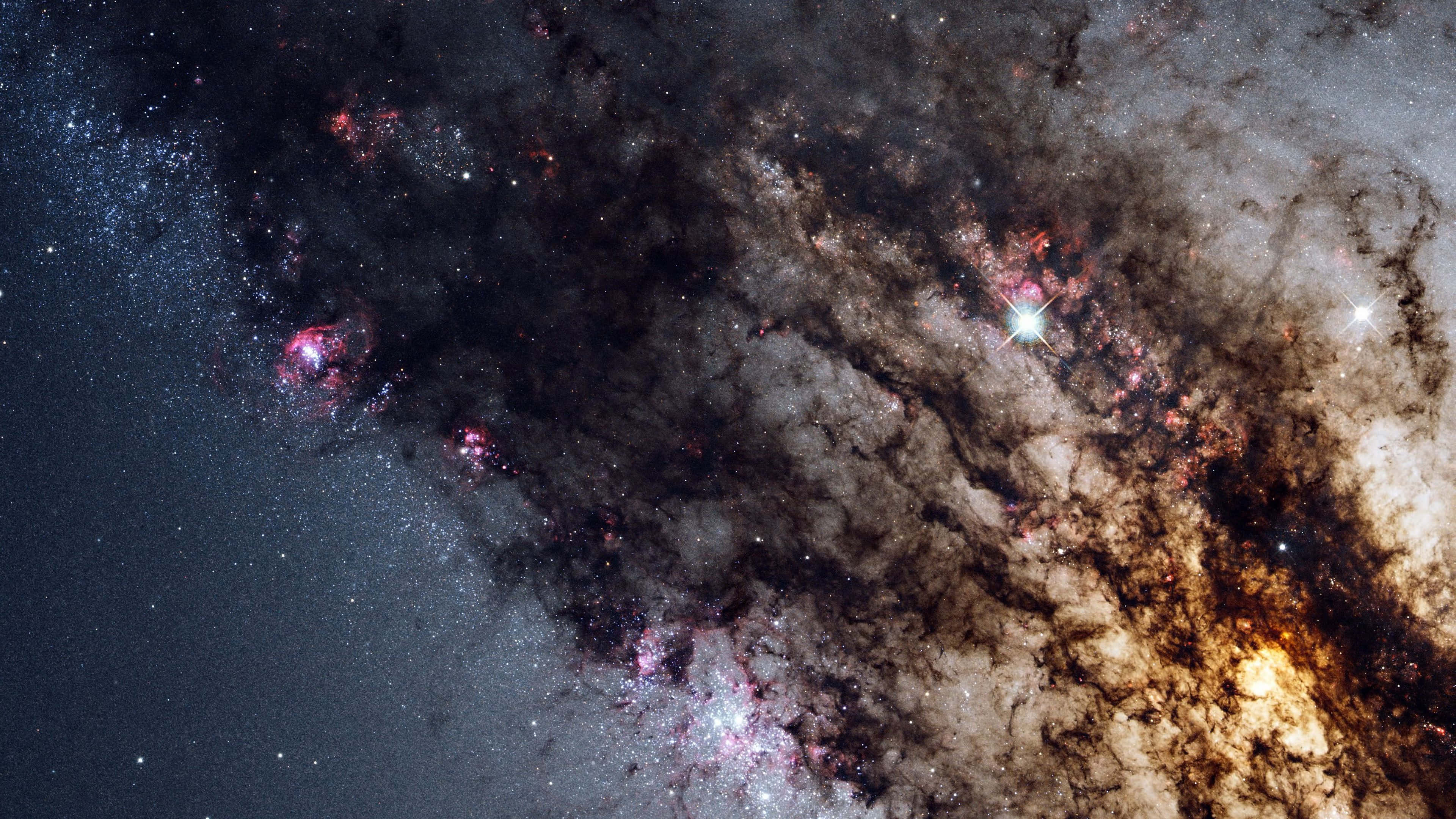 red swirling galaxies, cosmic nebula, glowing pink and orange gas clouds, 4K Desktop Wallpaper