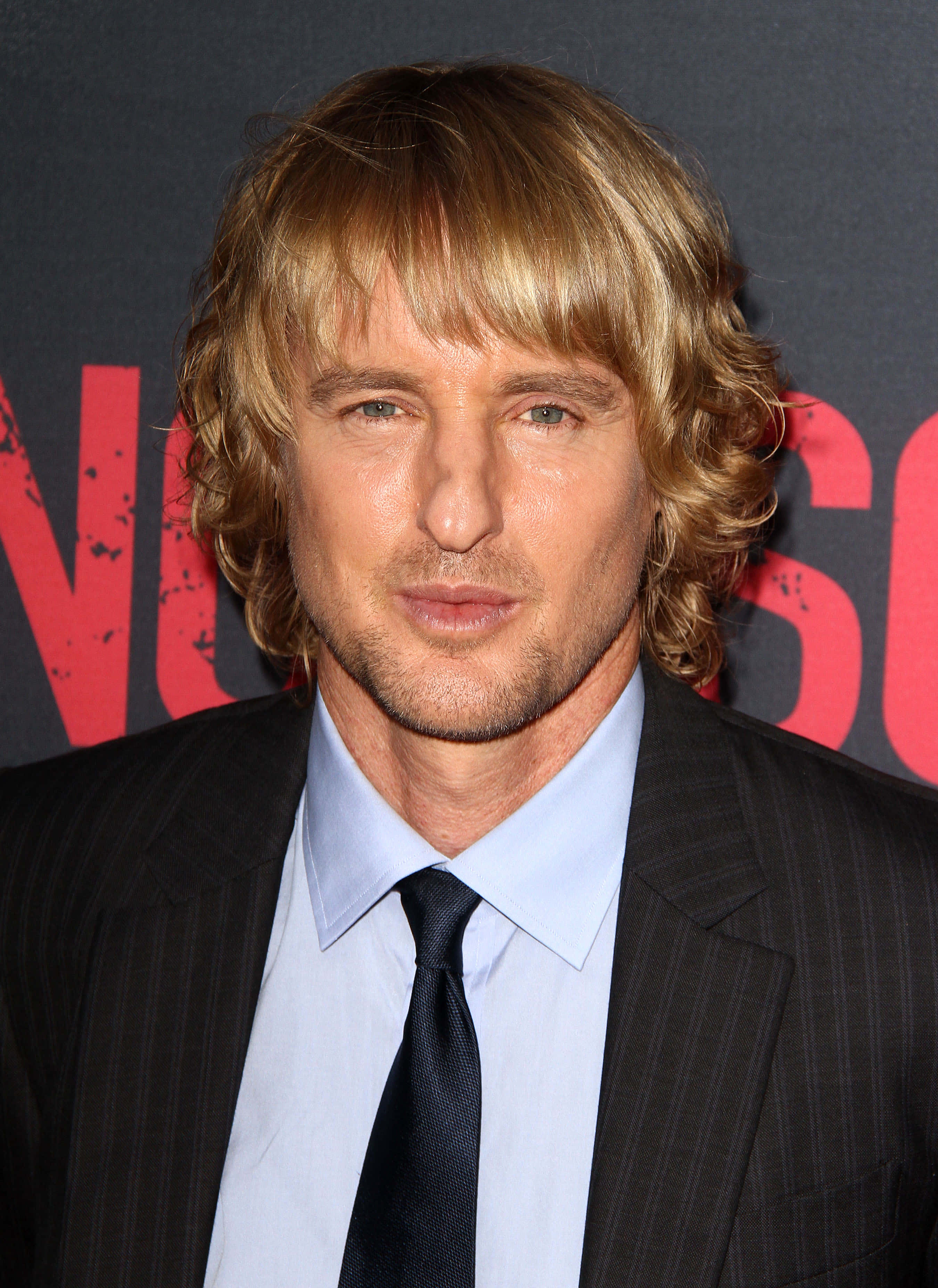 Owen Wilson, wavy blonde hair, dark pinstripe suit, 2K Phone Wallpaper