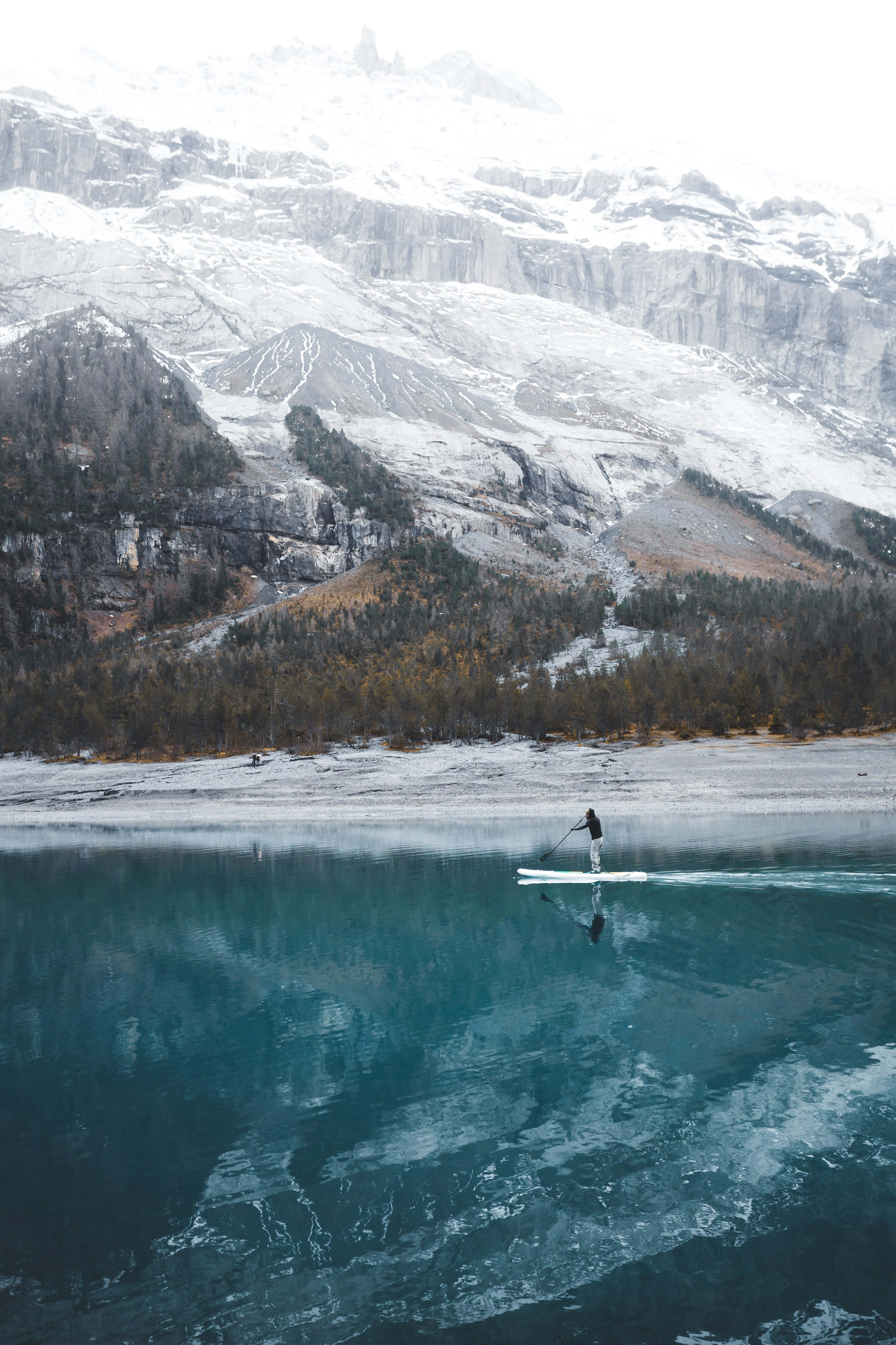 paddleboarder, turquoise lake, snow-dusted mountains, 5K Phone Wallpaper