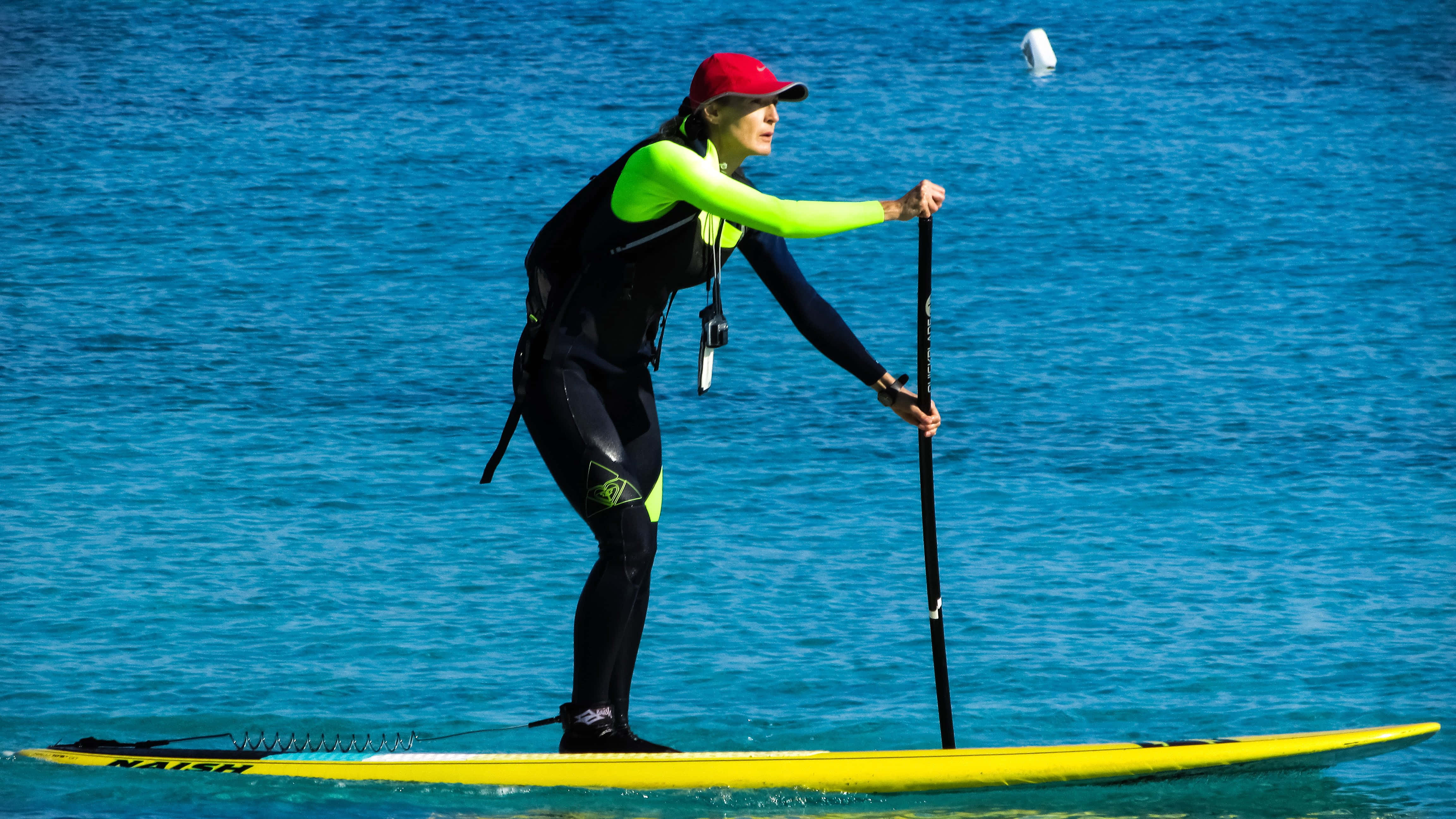 paddleboarding, red cap, neon wetsuit, 4K Desktop Wallpaper